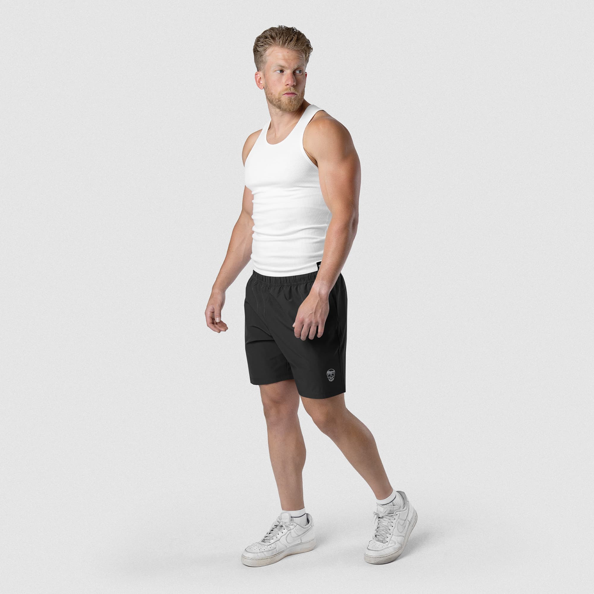 Model wearing Men's Conquer 7 Inch Shorts - Black