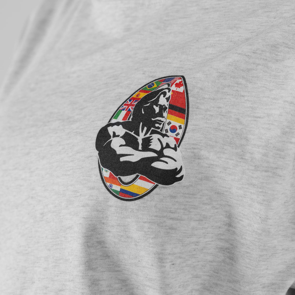 Close up view of the international flag Olympia bodybuilding logo on the chest of the Olympia International Division Crop Long Sleeve