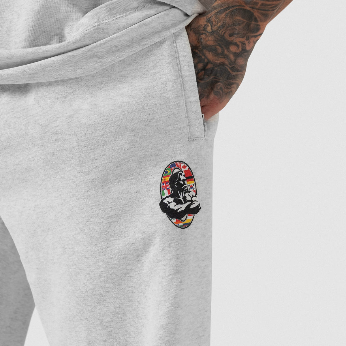 Close up of International Flag Olympia Logo and pocket on the Olympia International Division Straight-Leg Jogger in gray