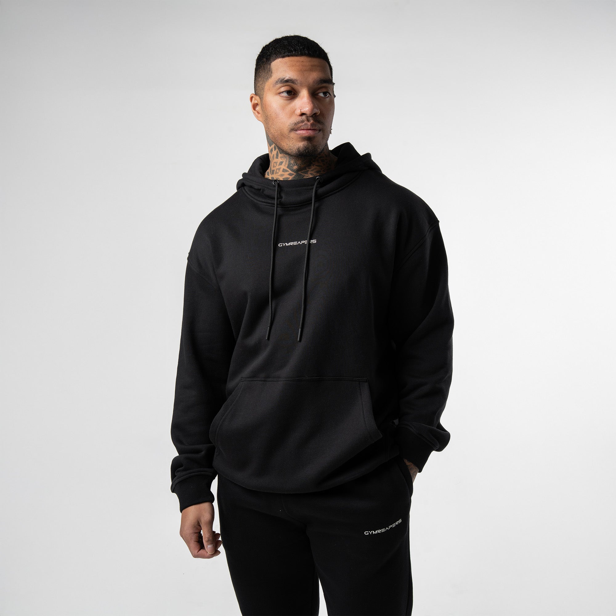 athlete wearing black/white axis mockneck hoodie front view