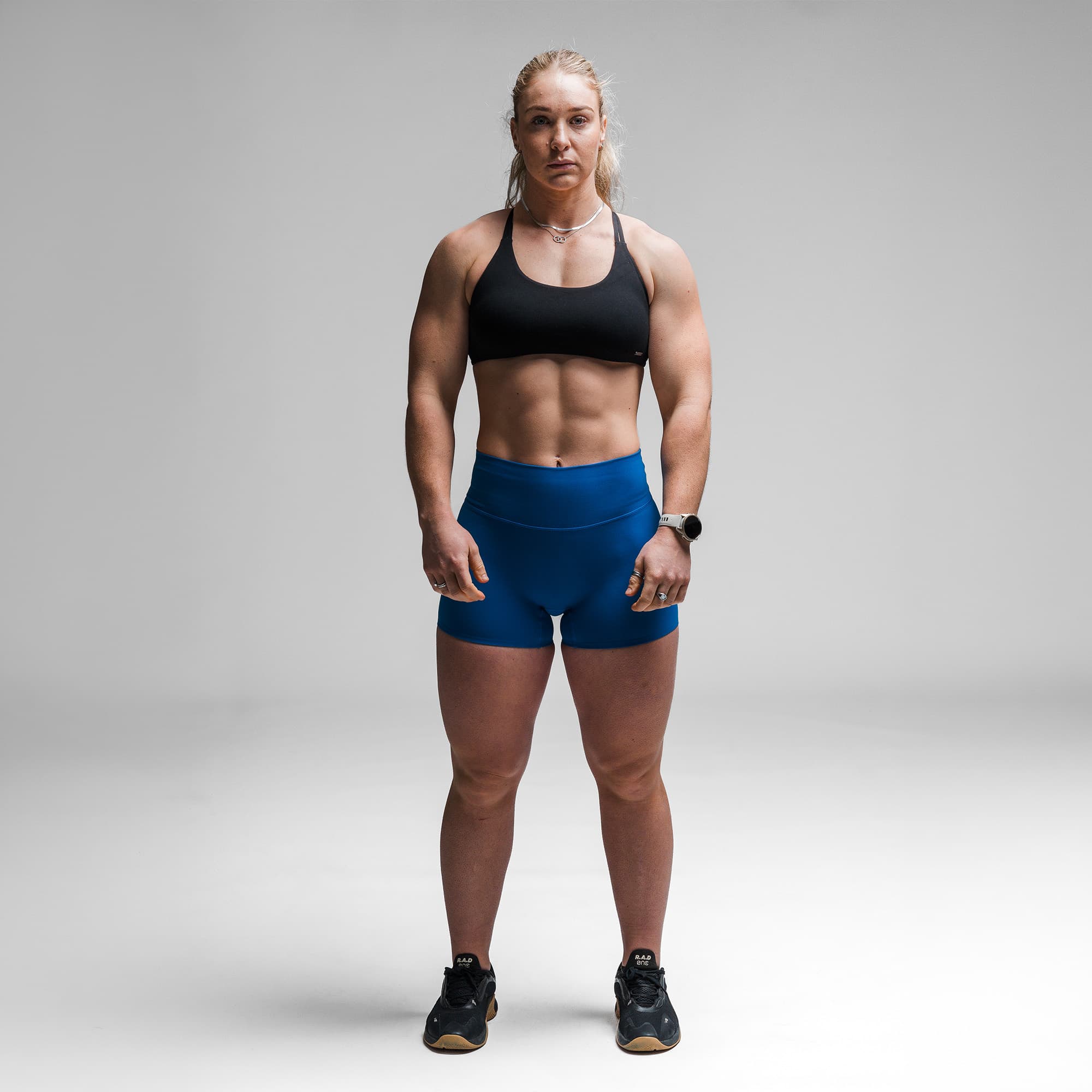 Athlete wearing the Electric Blue Axis 4" Shorts full body shot front view
