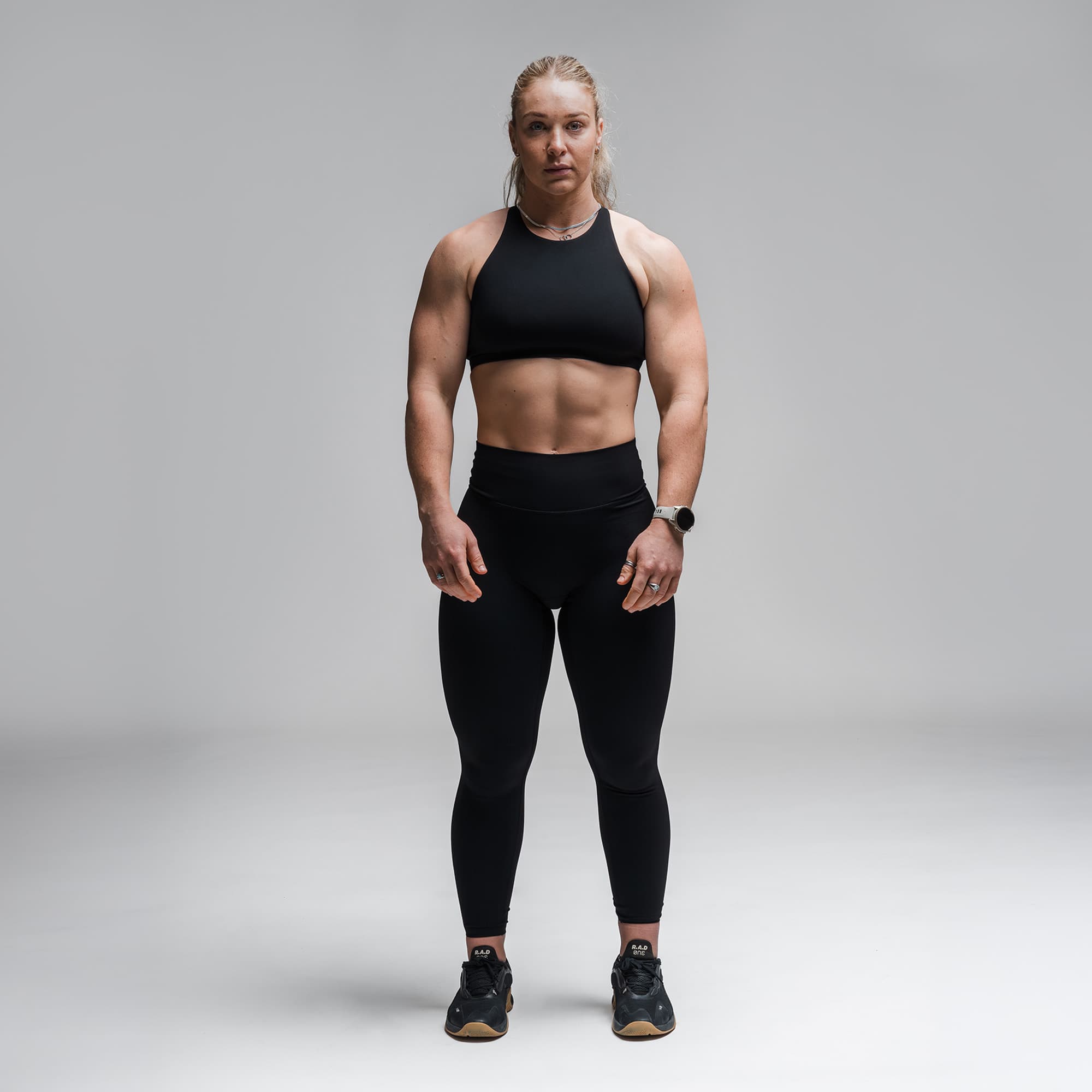 Athlete wearing the Black Axis High Neck Bra full body shot front view