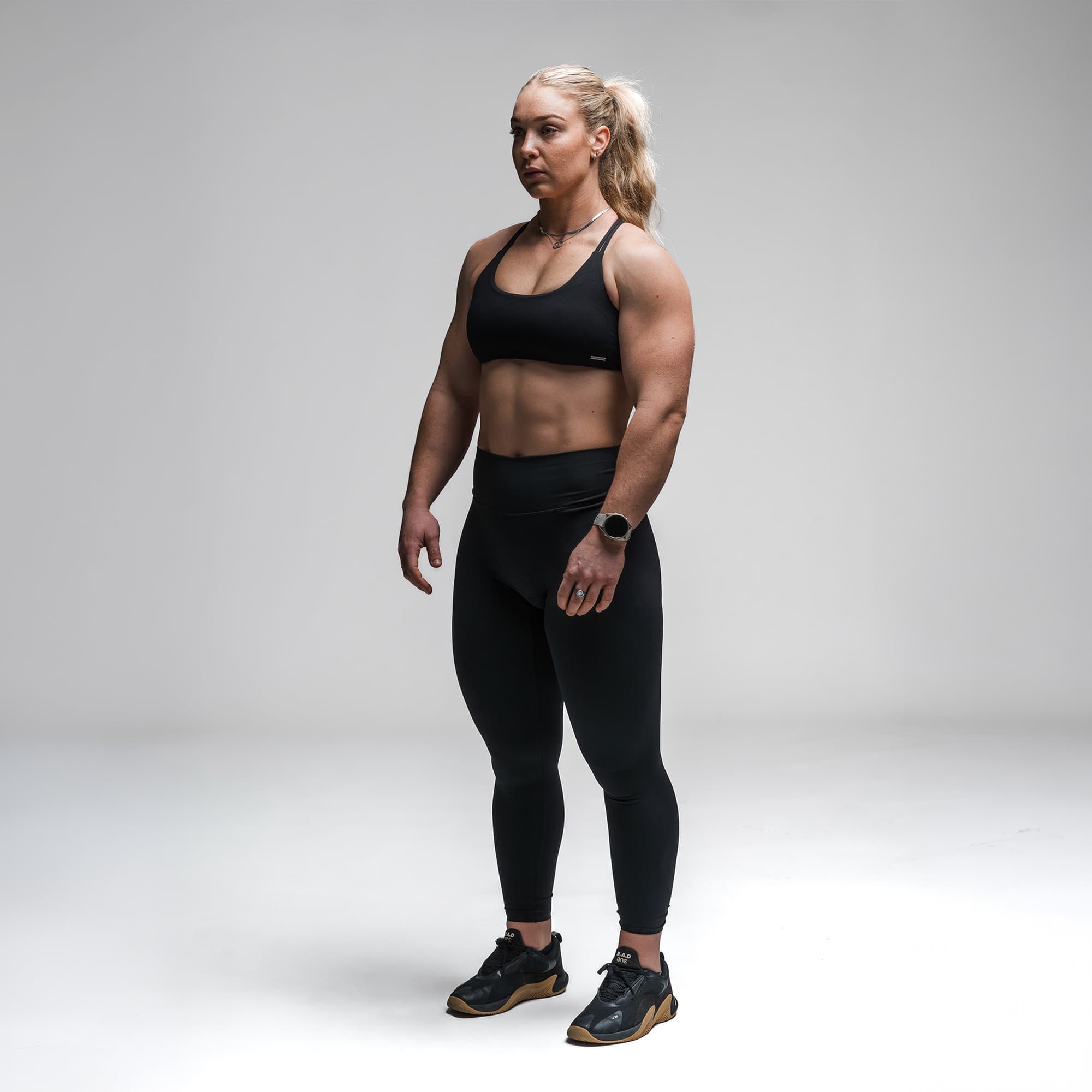 Athlete wearing the Black Axis Open Back Bra full body shot front view