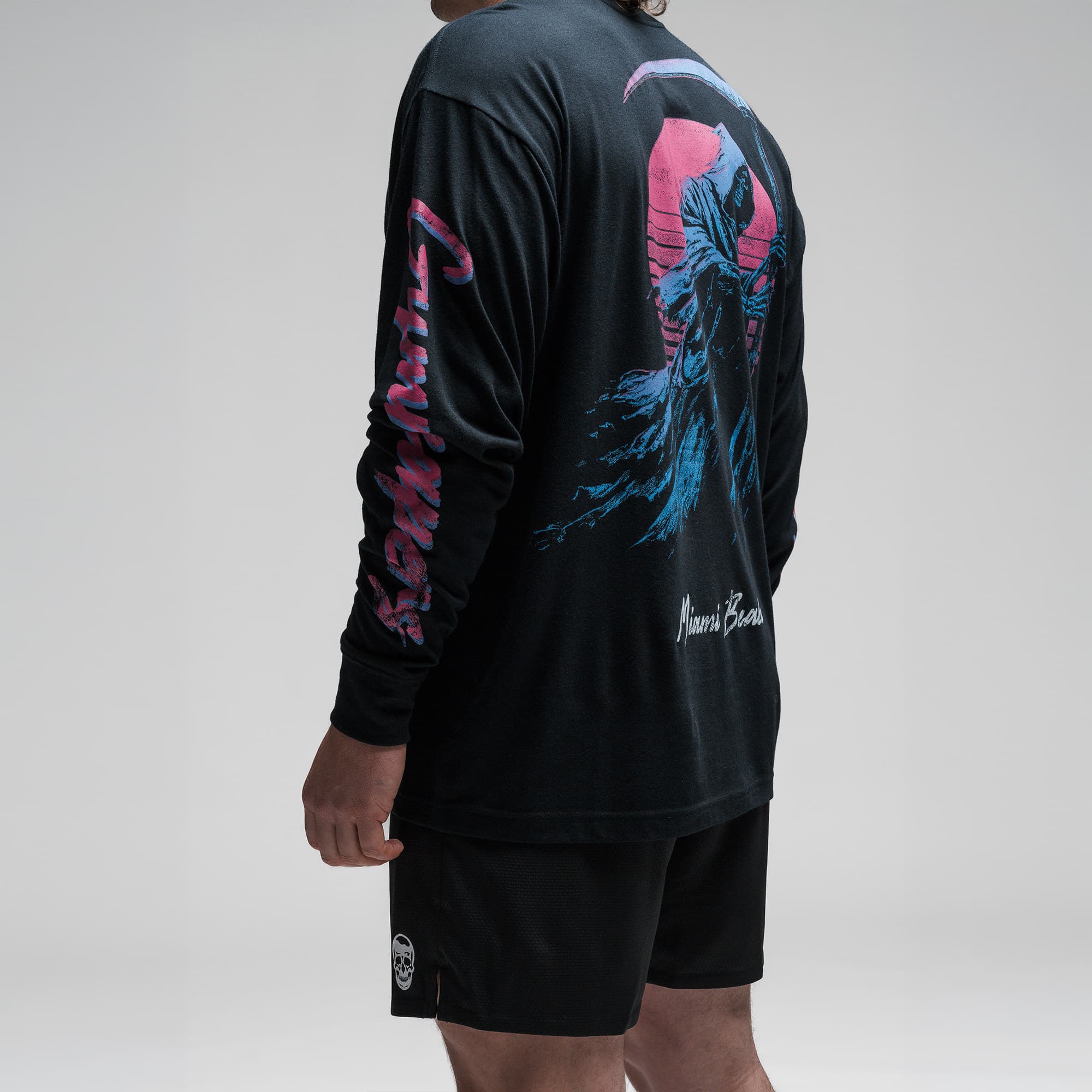 Athlete wearing the Moon Breaker Long Sleeve Shirt detail shot of left sleeve graphics