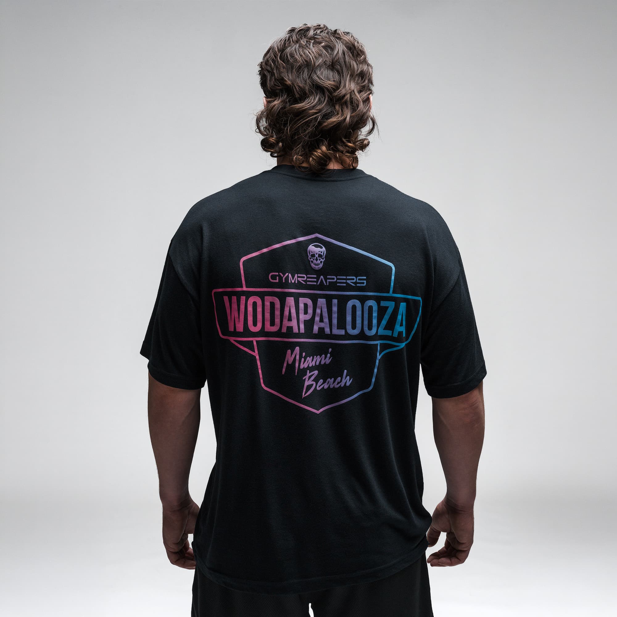Athlete wearing the Gymreapers WZA Shield Tee half body shot back view