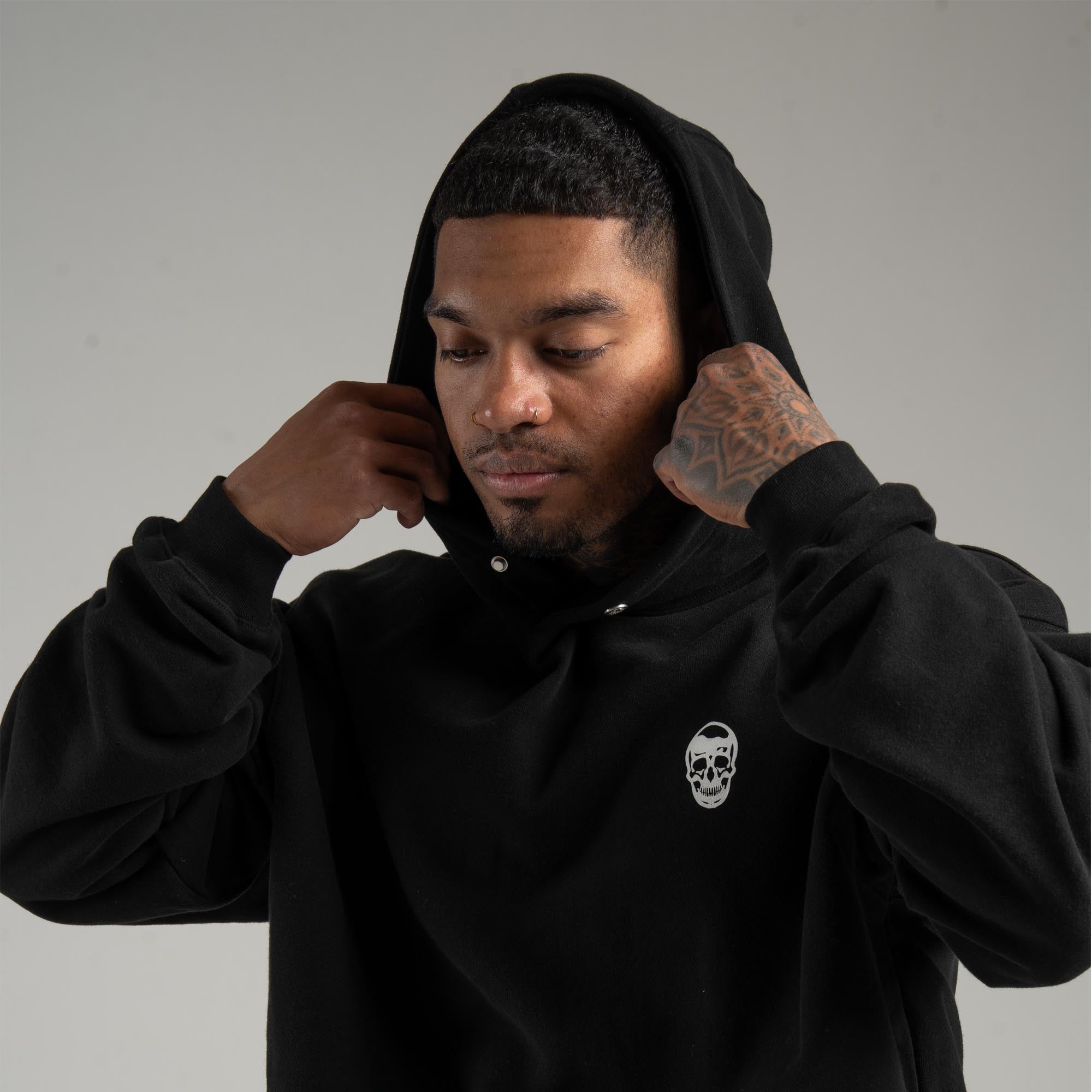 athlete wearing the heavyweight hoodie with hood on