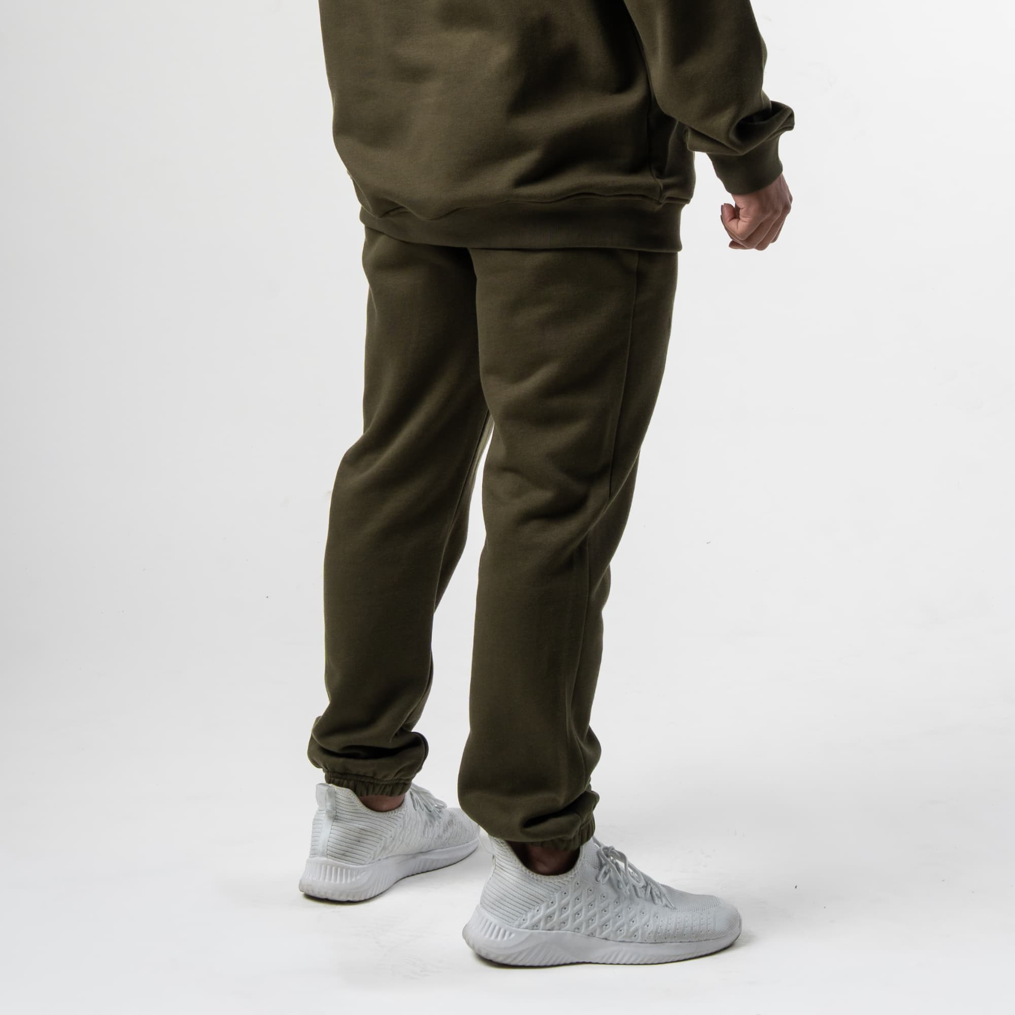 athlete wearing green axis joggers side view