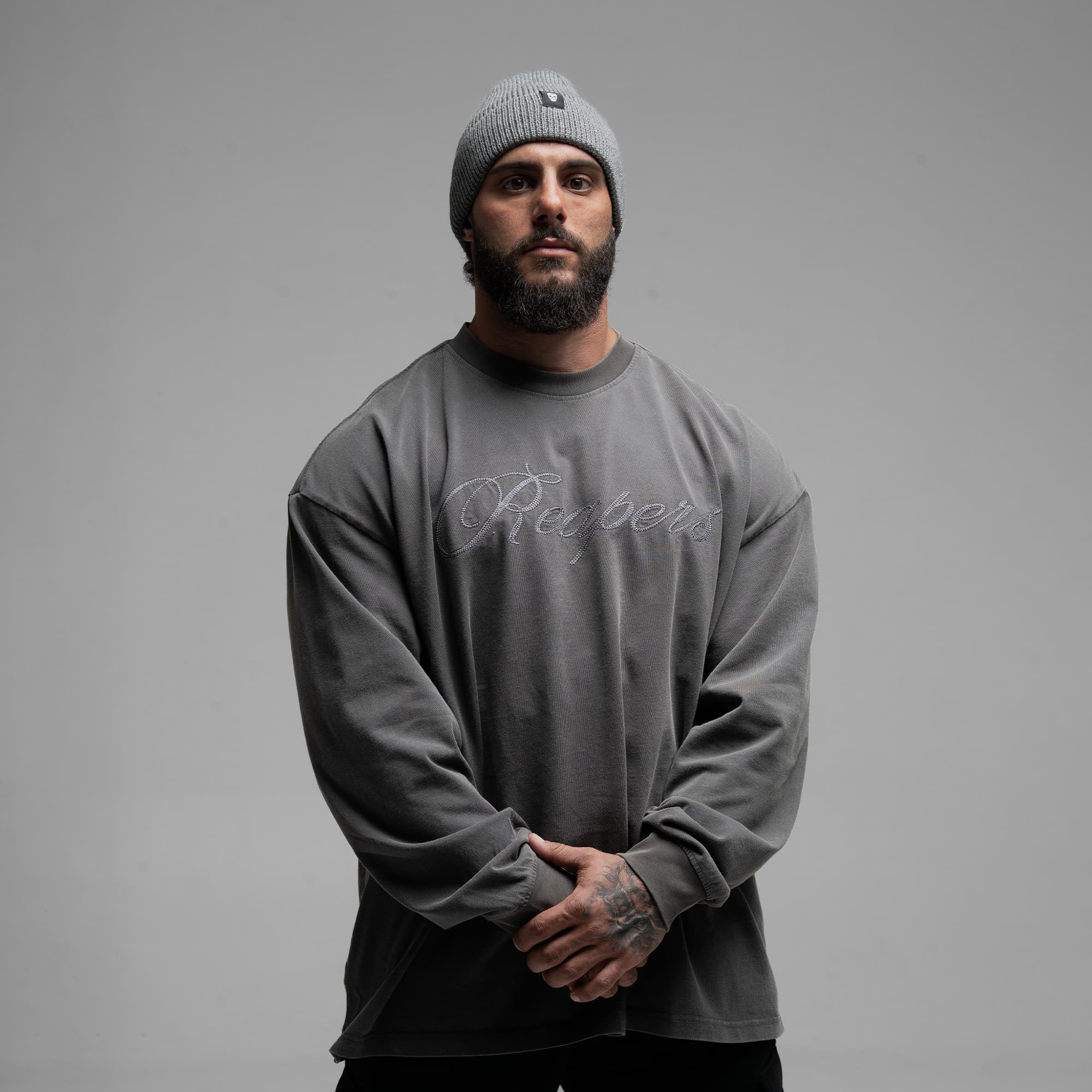 Athlete wearing Reaper Chainscript Long Sleeve Shirt half body shot front side