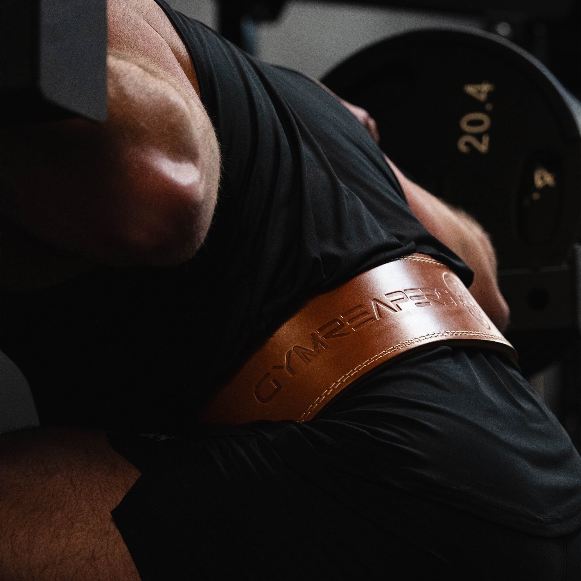 Shot of athlete squatting while wearing the heritage single prong belt