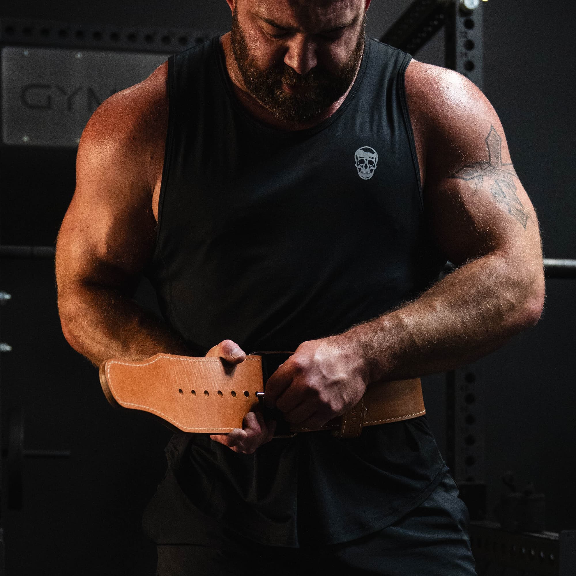 Shot of athlete latching down the heritage single prong belt