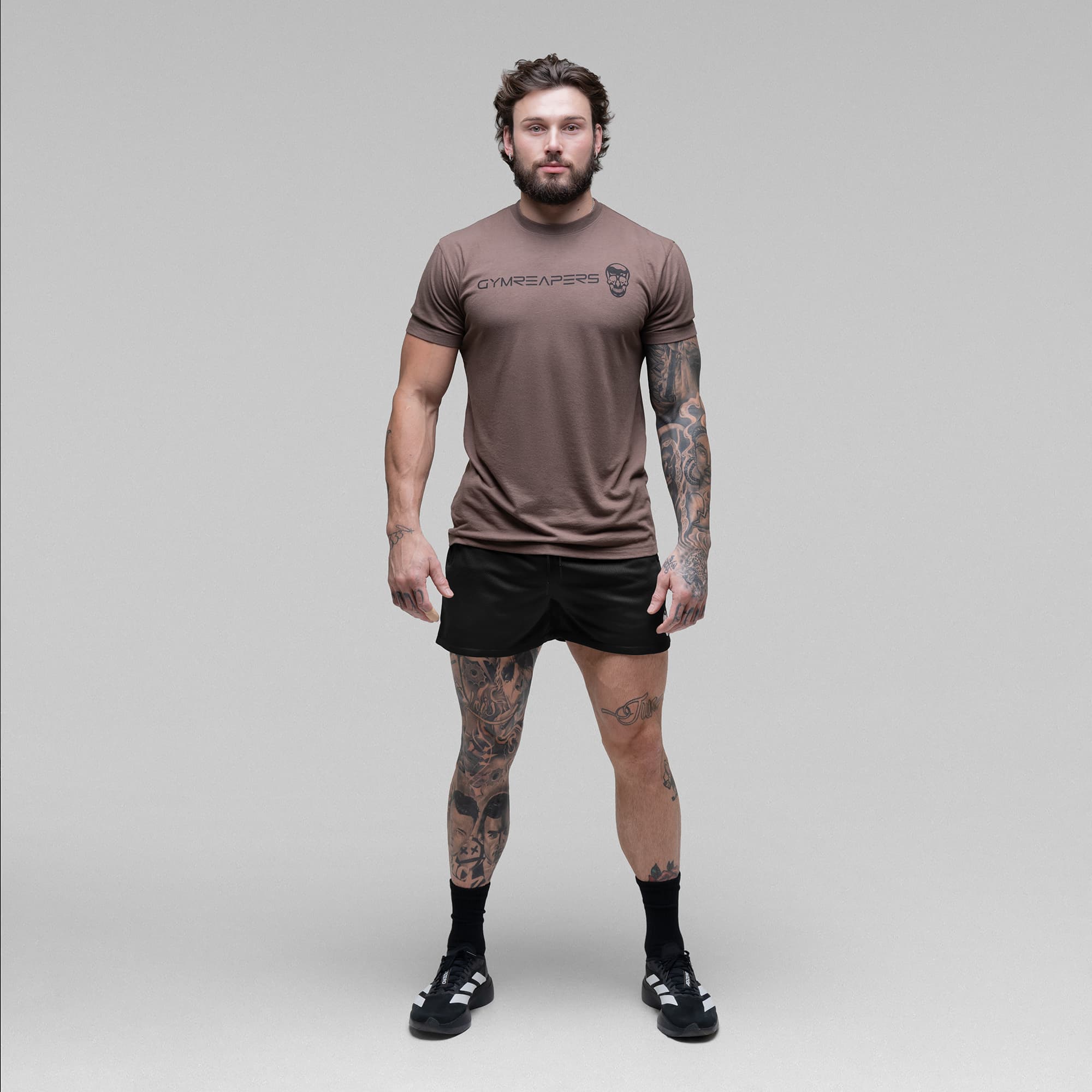 Athlete wearing the Black/White Core Skull Mesh Training Shorts full body shot