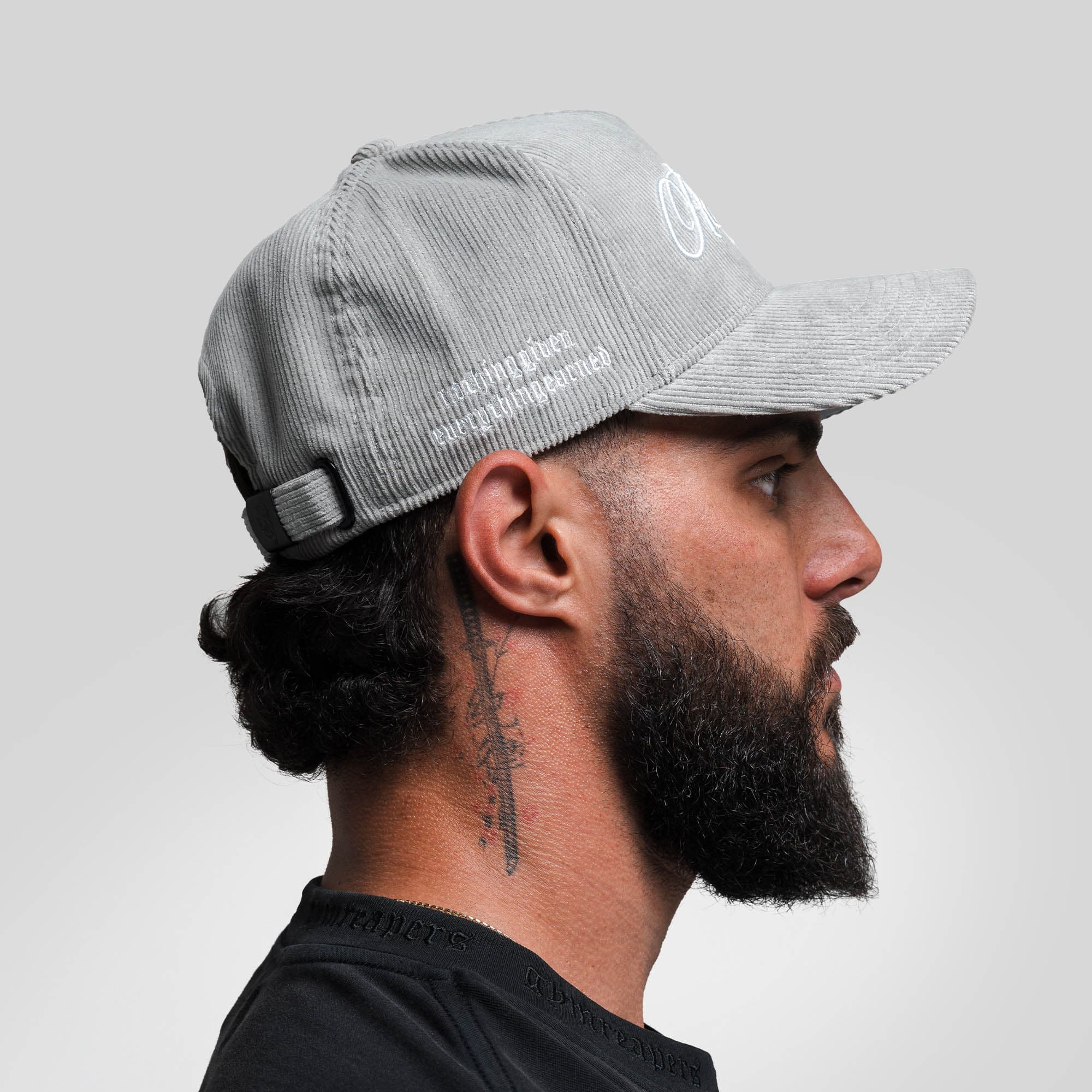 Athlete wearing Corduroy Reapers 5-Panel Hat - Gray/White side view