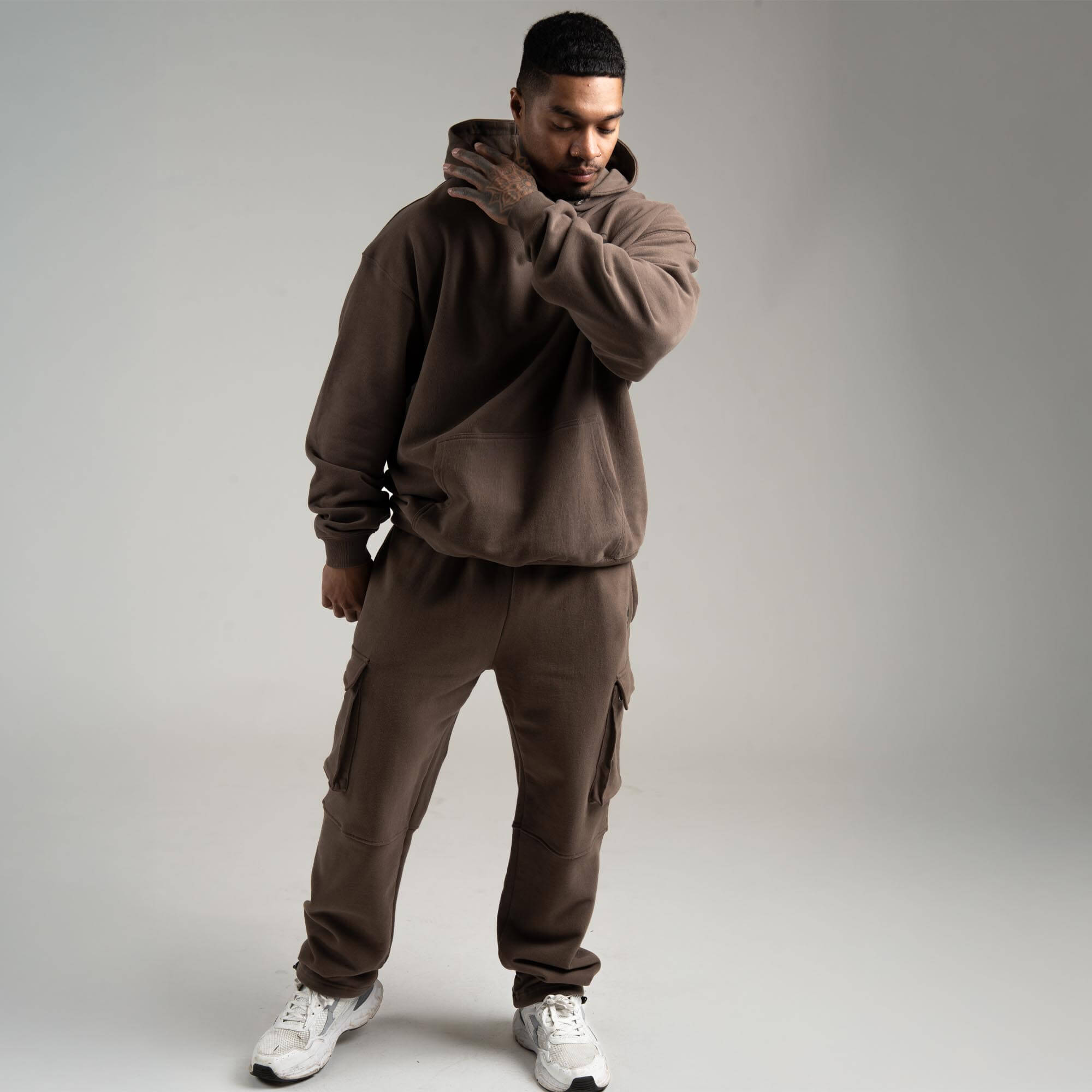 athlete wearing Toffee Heavyweight Hoodie full body shot