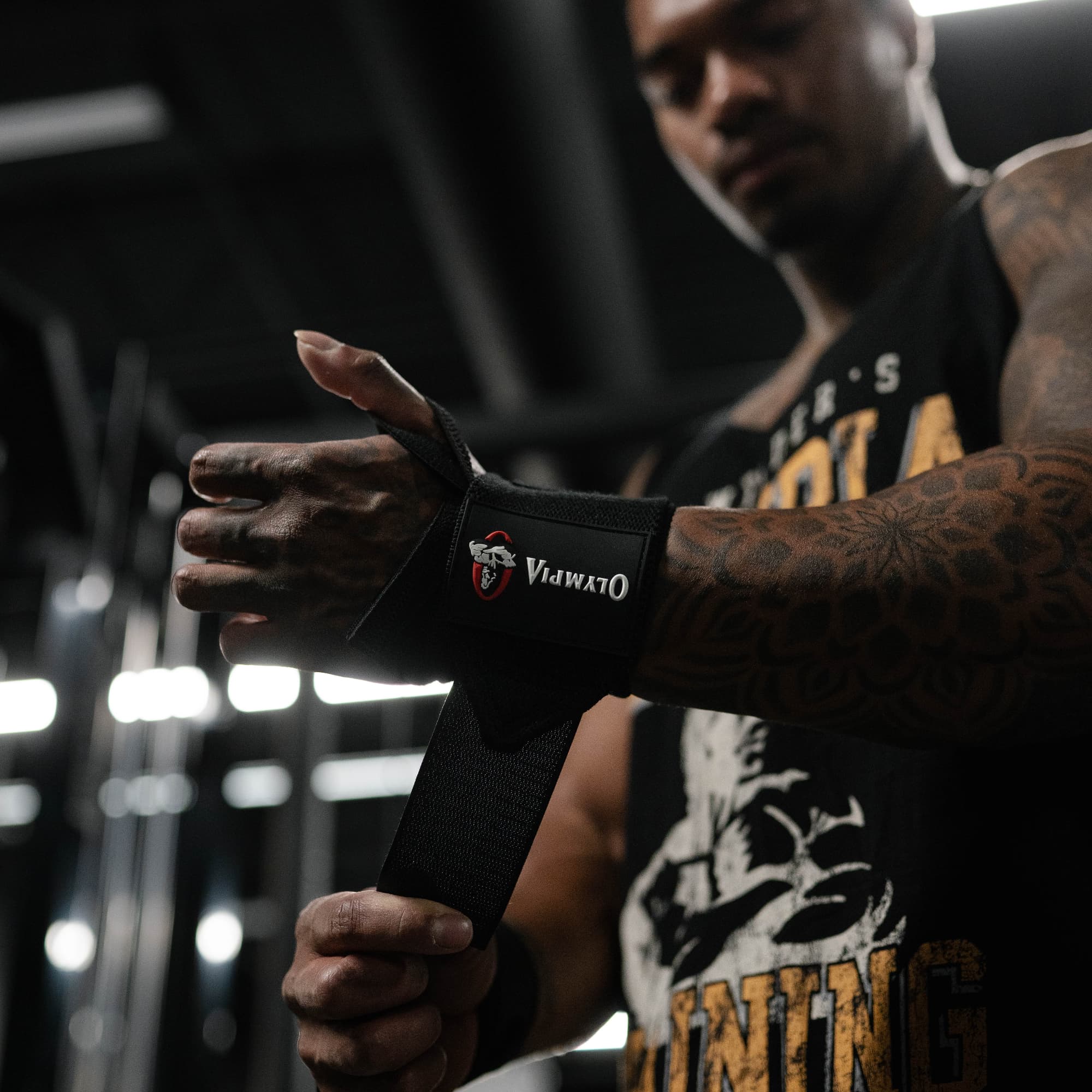 athlete wrapping 18" Olympia Wrist Wraps around wrist