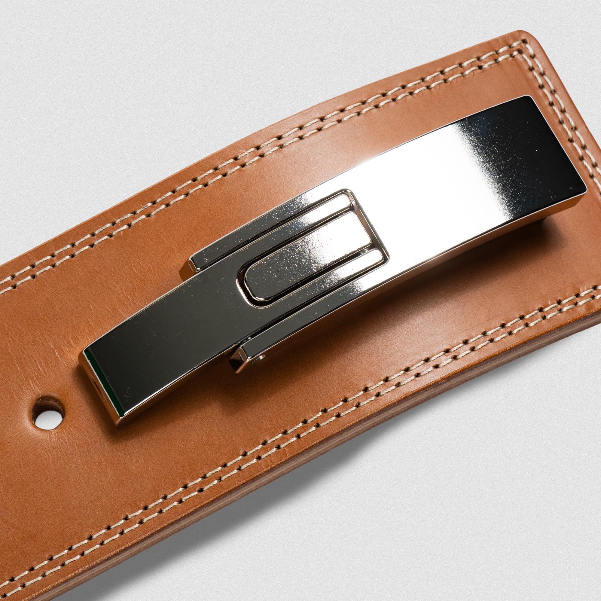 Close up shot of heritage lever belt showcasing the detail in the stitching and lever