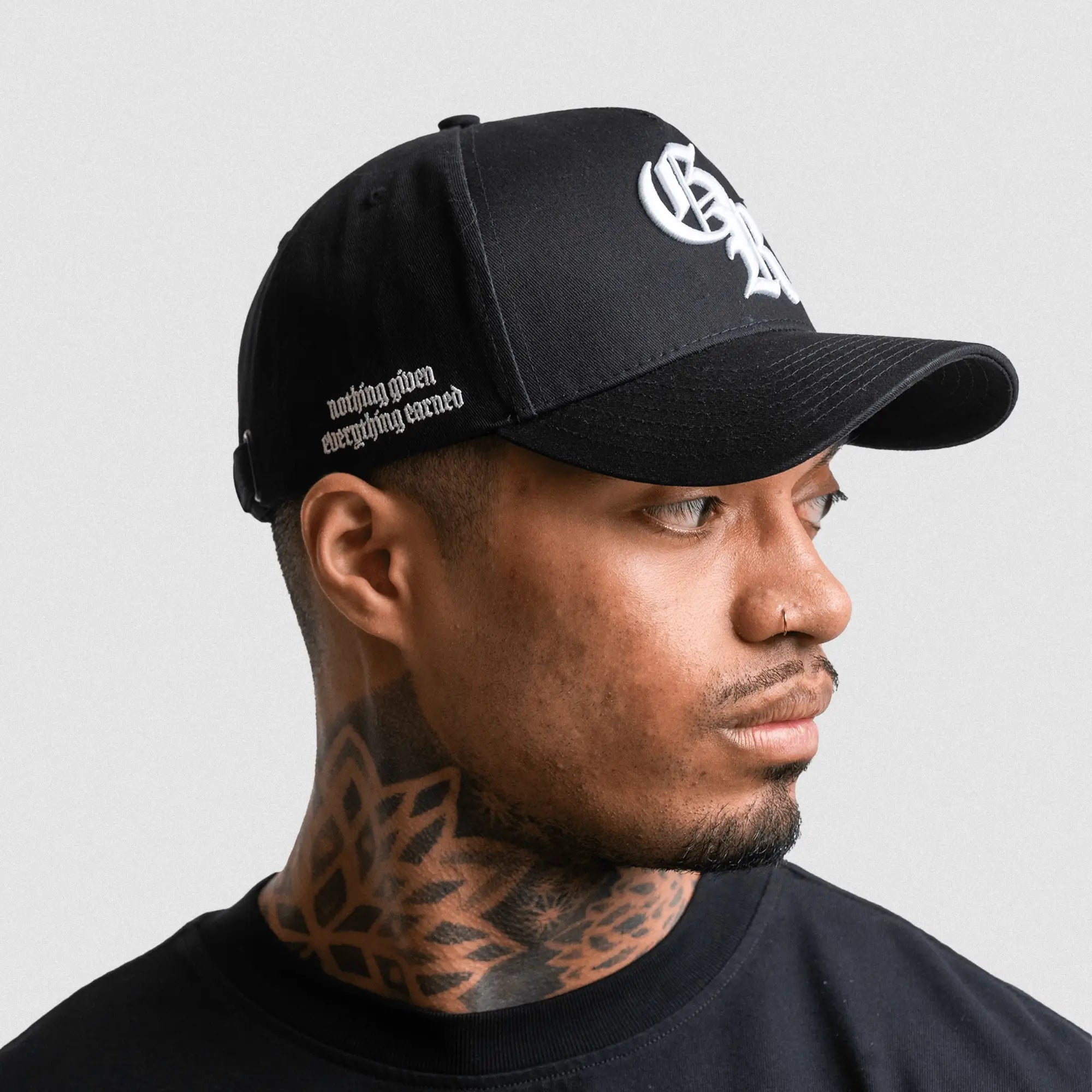 5 panel initial hat black white on athlete studio gray background right side mantra