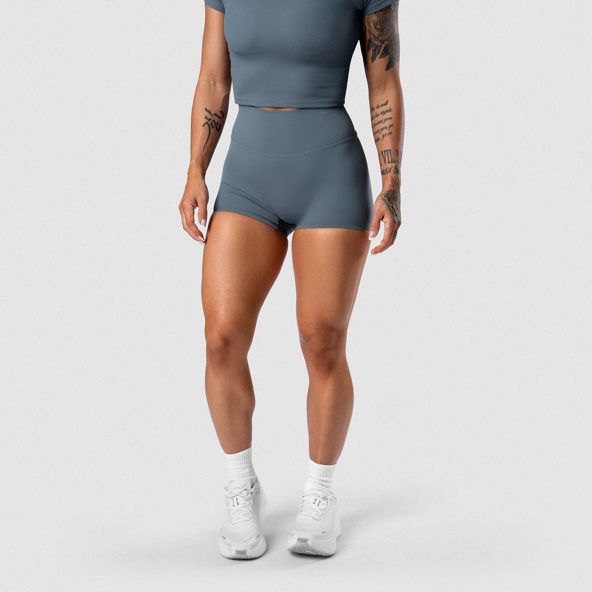 Female model wearing the Axis 4" Shorts - Lake front view