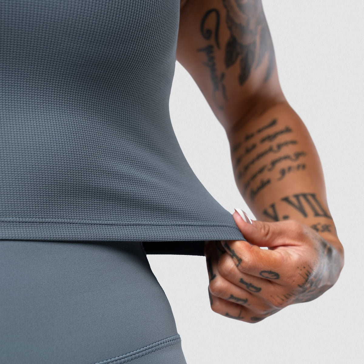 Axis Support Baby Tee - Lake side hem stretch detail