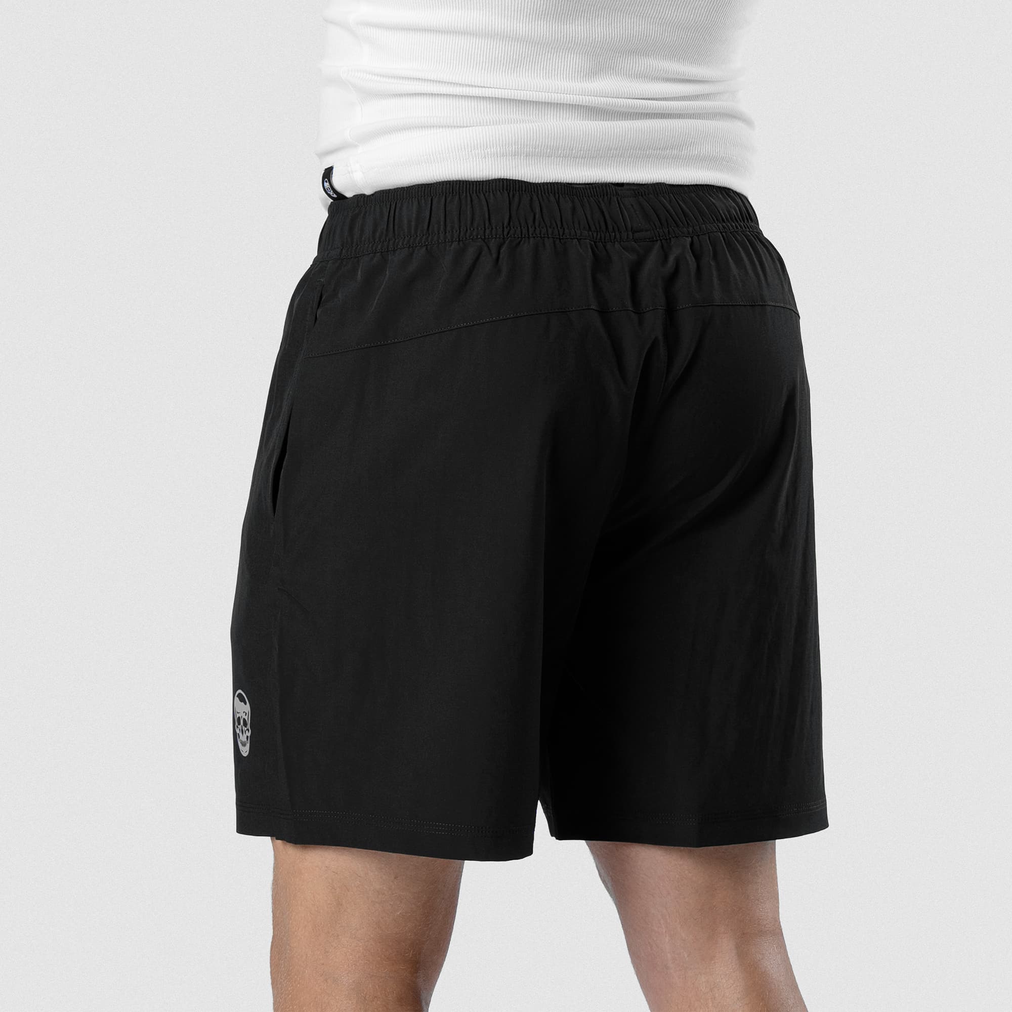 Back view of Men's Conquer 7 Inch Shorts on model - Black
