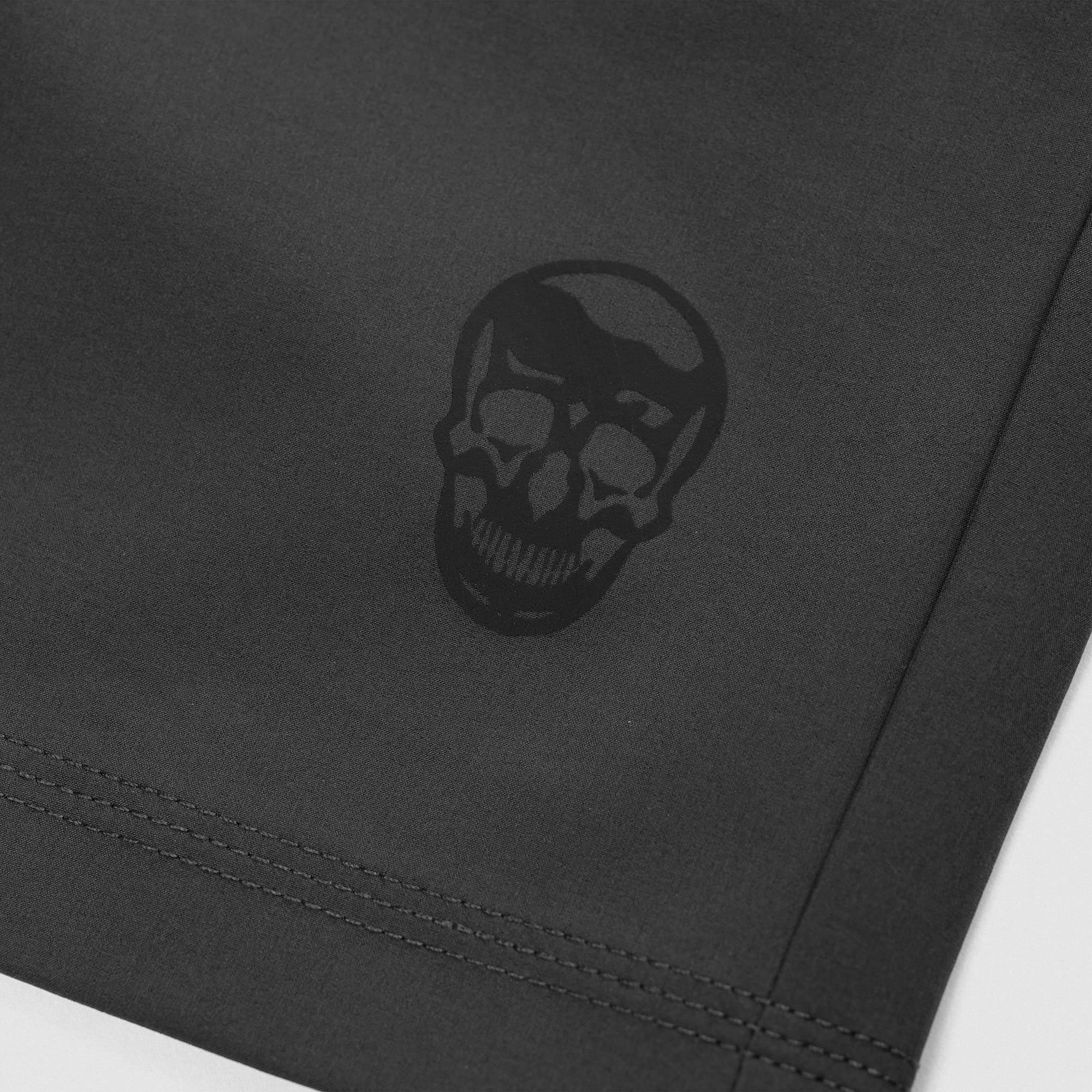 Reflective Gymreapers skull logo detail on Men's Conquer 5 Inch Shorts - Dark Gray