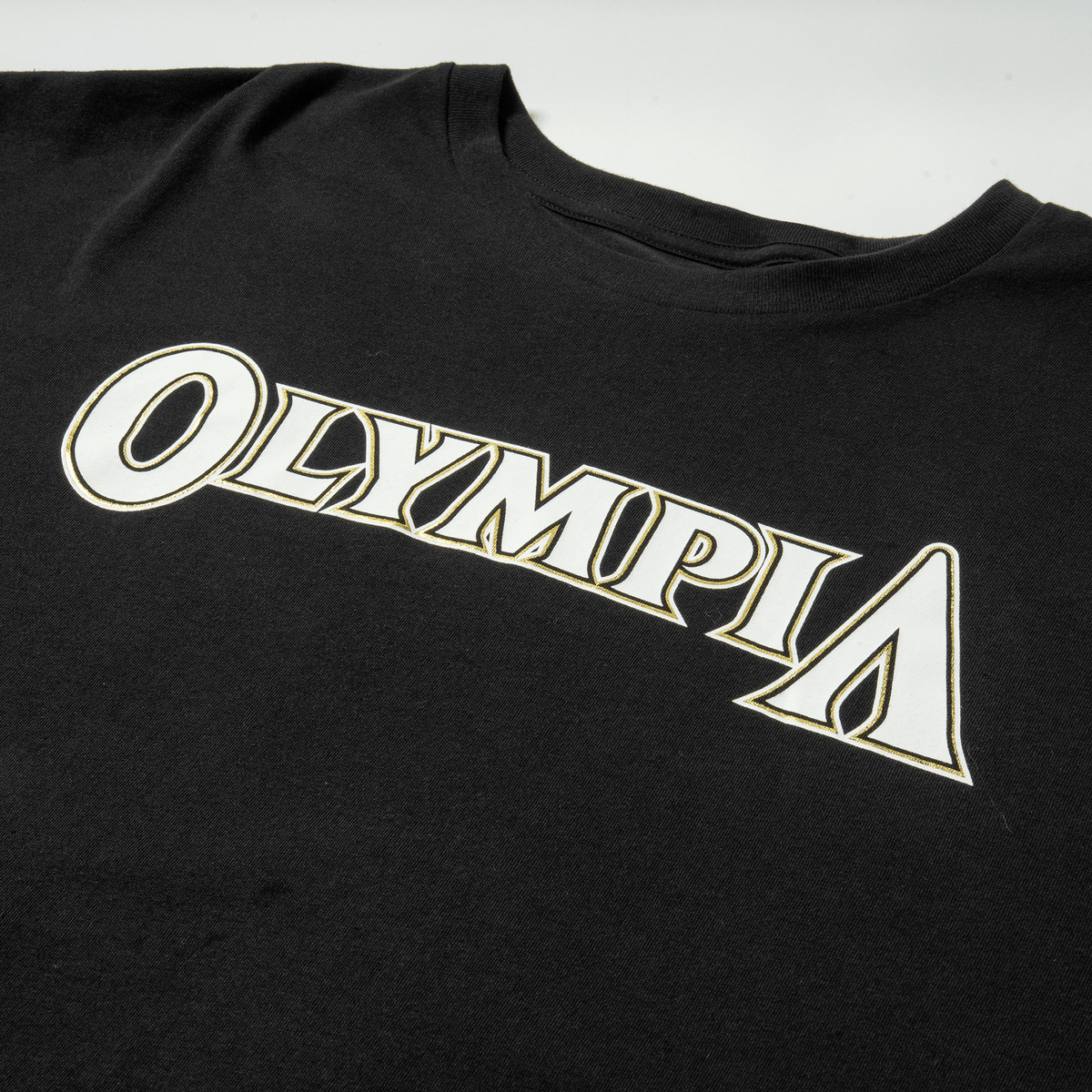 "OLYMPIA" Chest Logo Detail
