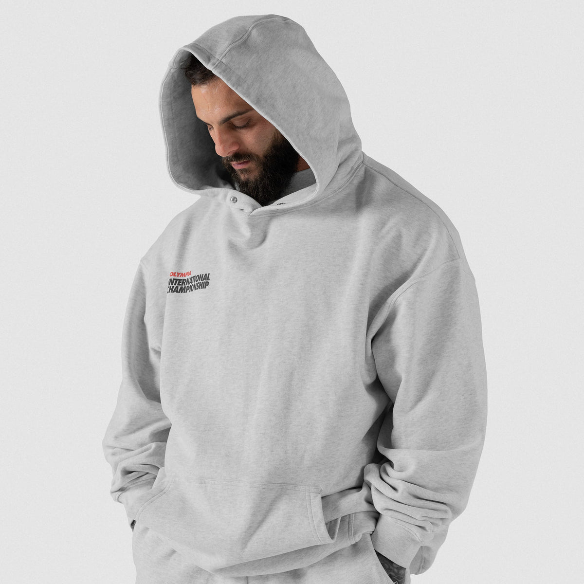 International Division Hoodie | Front model view of male wearing the gray hoodie, hood up