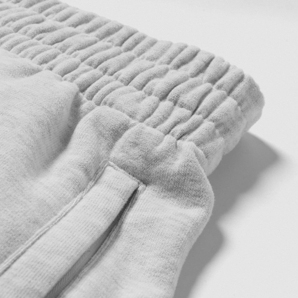 Close up of adjustable waistband and pocket on the Olympia International Division Straight-Leg Jogger in Gray