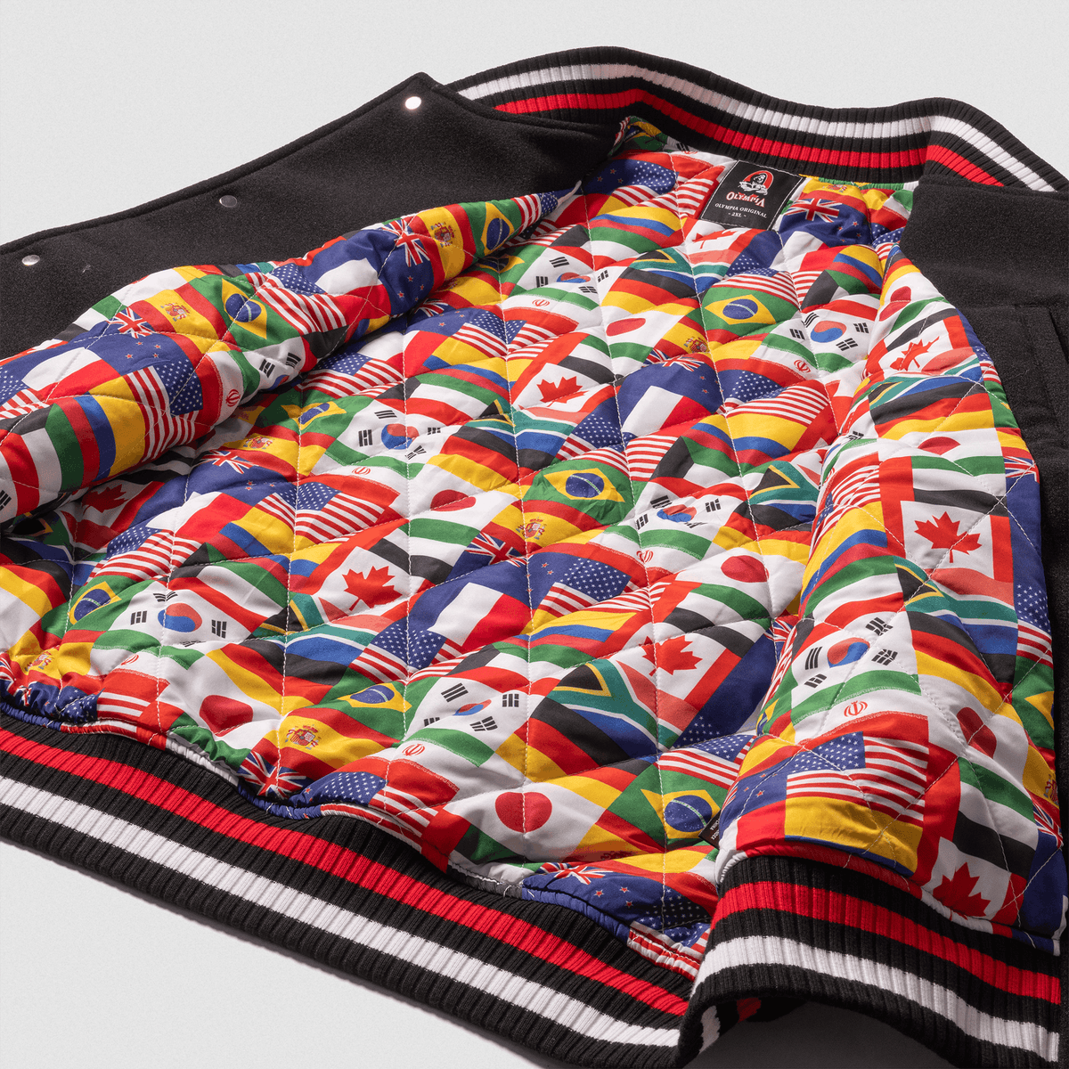 Olympia International Division Varsity Jacket in Black – Flag-Print Interior Lining Detail