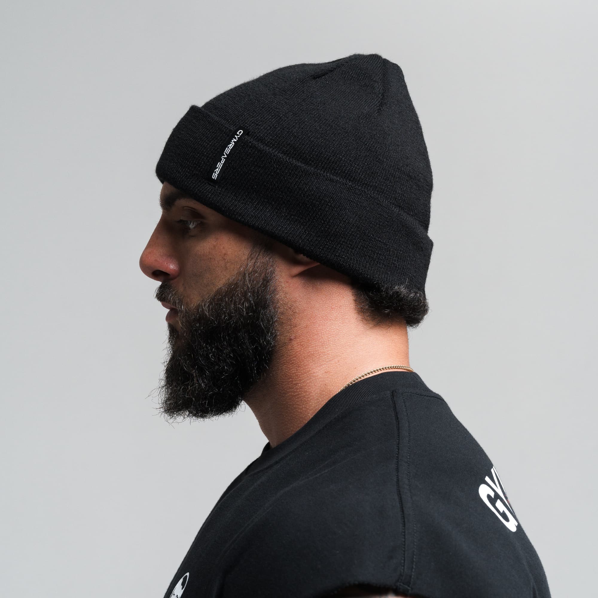Athlete wearing Core Knit Cuff Beanie - Black side view