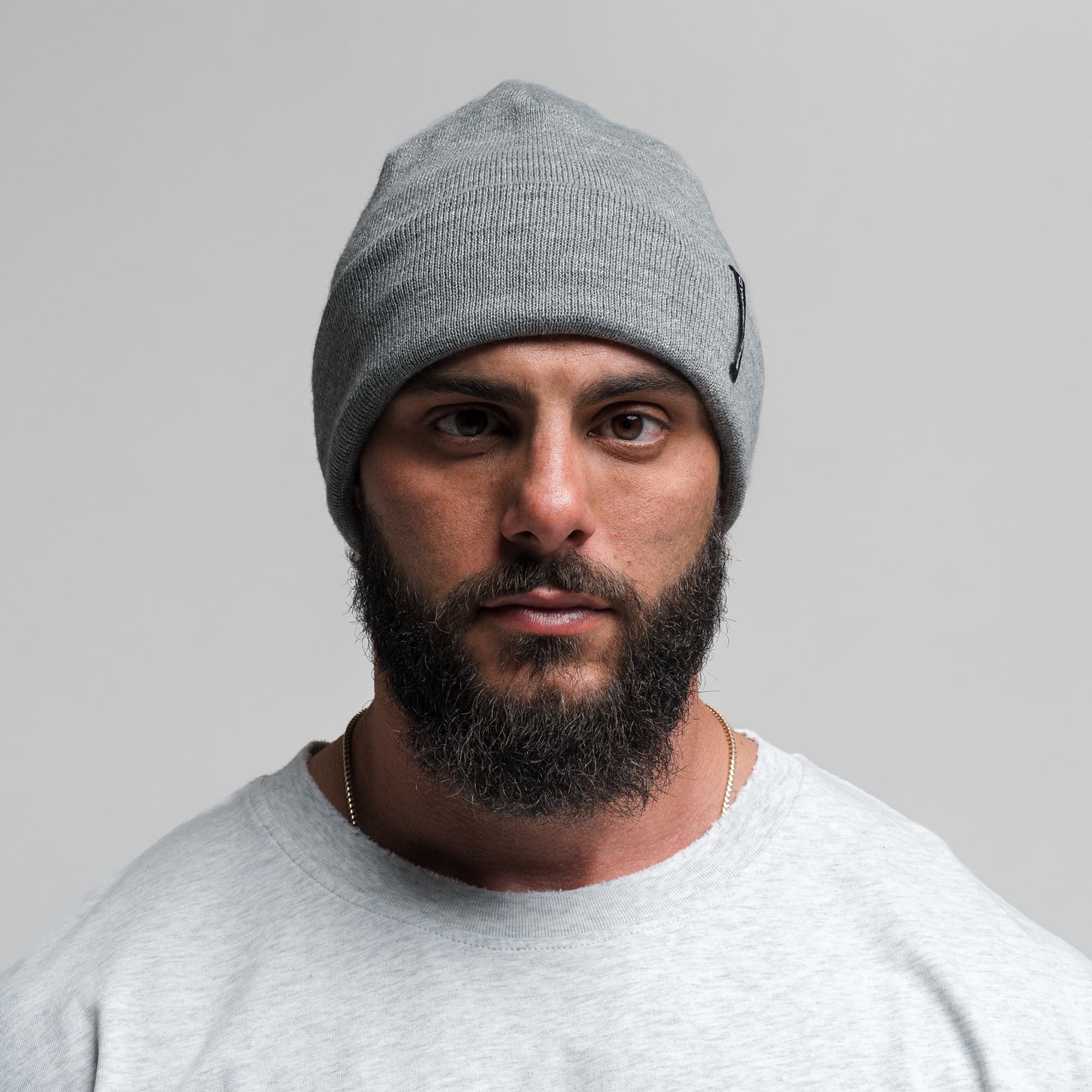 Athlete wearing Core Knit Cuff Beanie - Dark Gray front view