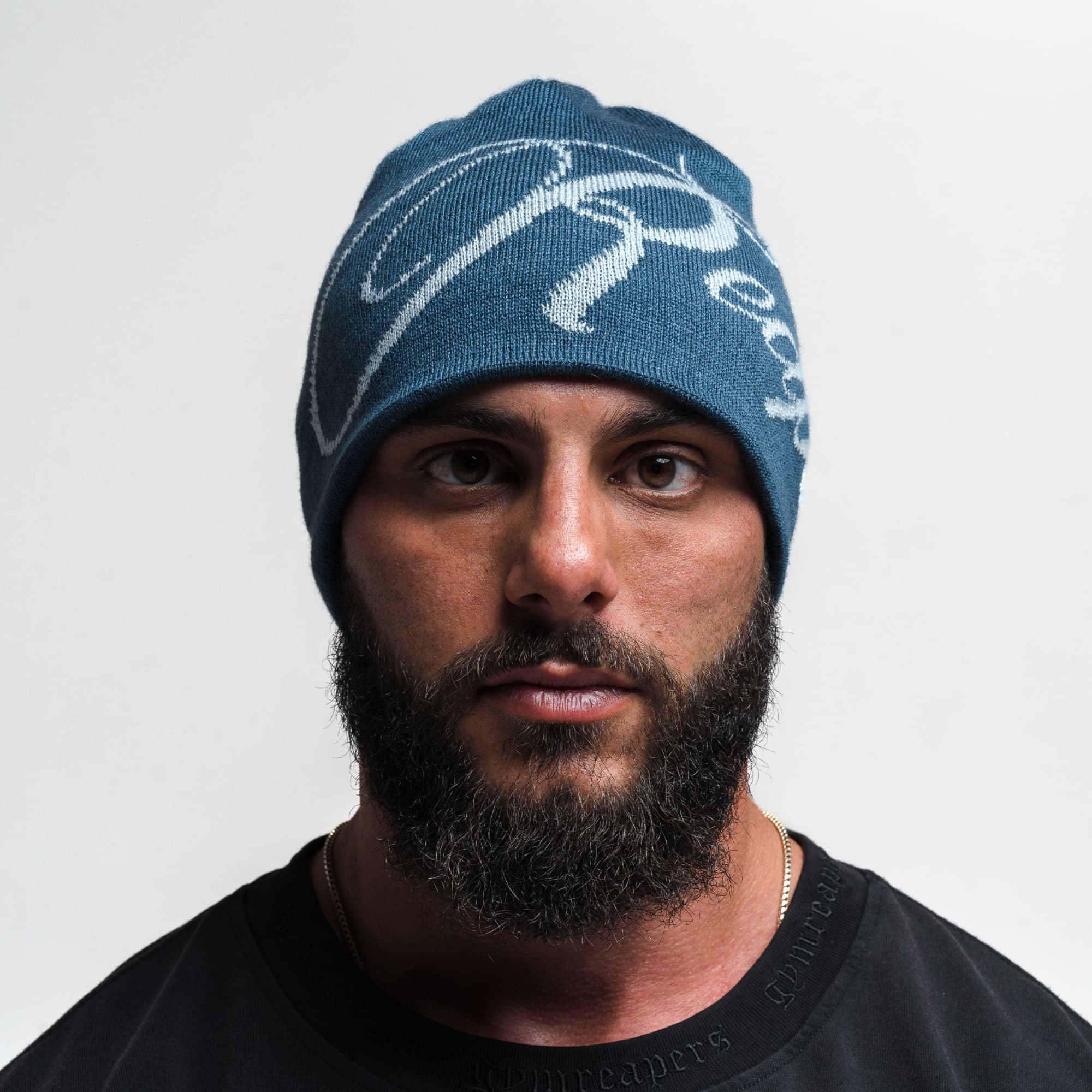 Athlete wearing Reapers Skull Cap Beanie - Blue/Glacier front view