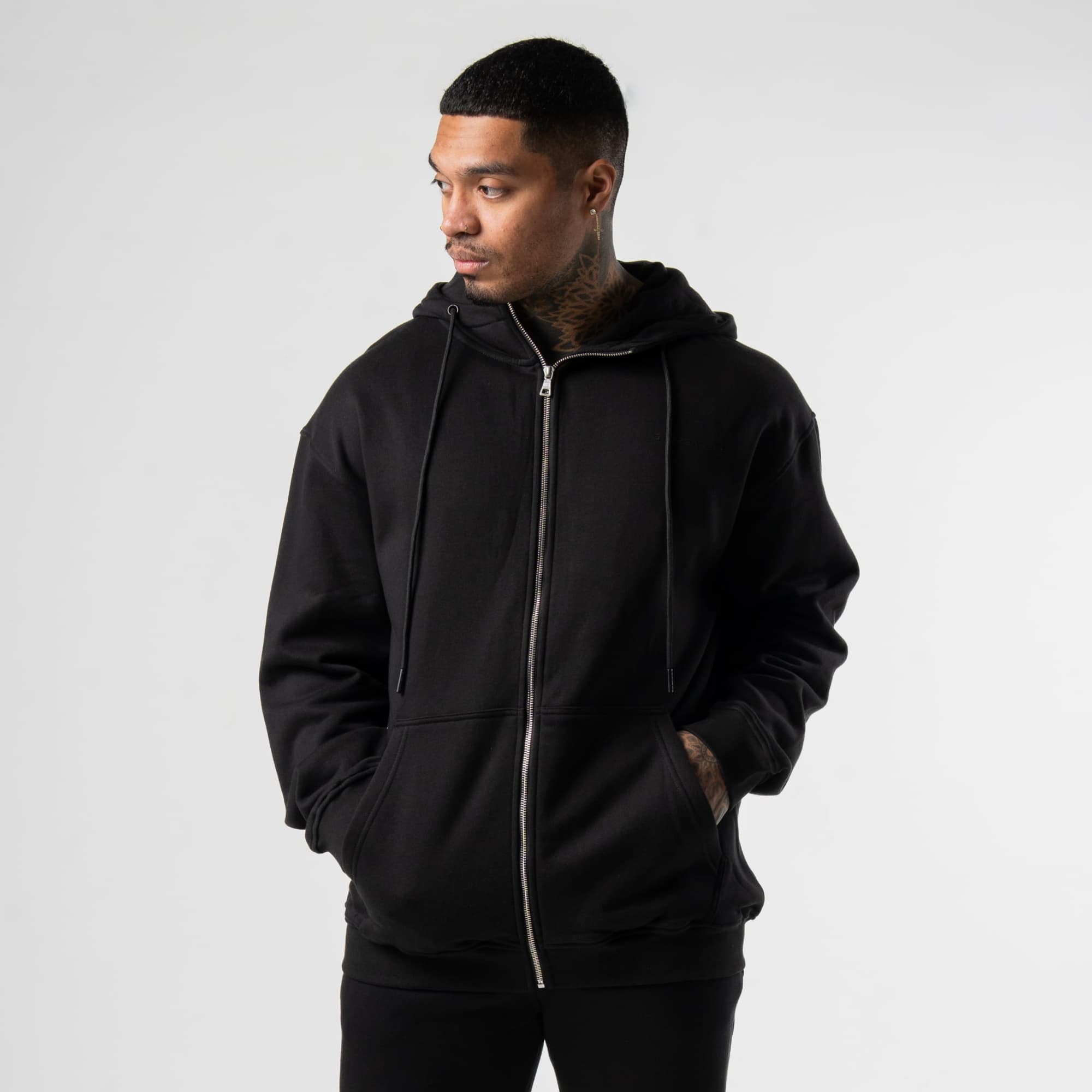 athlete wearing the black/black zip hoodie