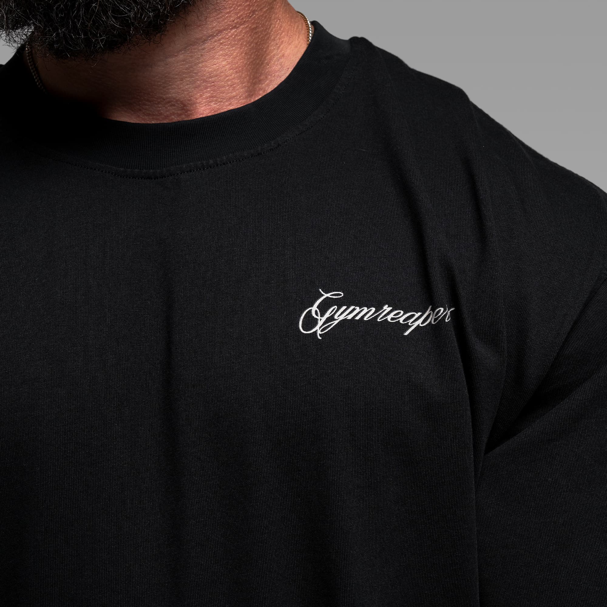 Athlete wearing the Midnight Reaper Tee close up shot of front graphic