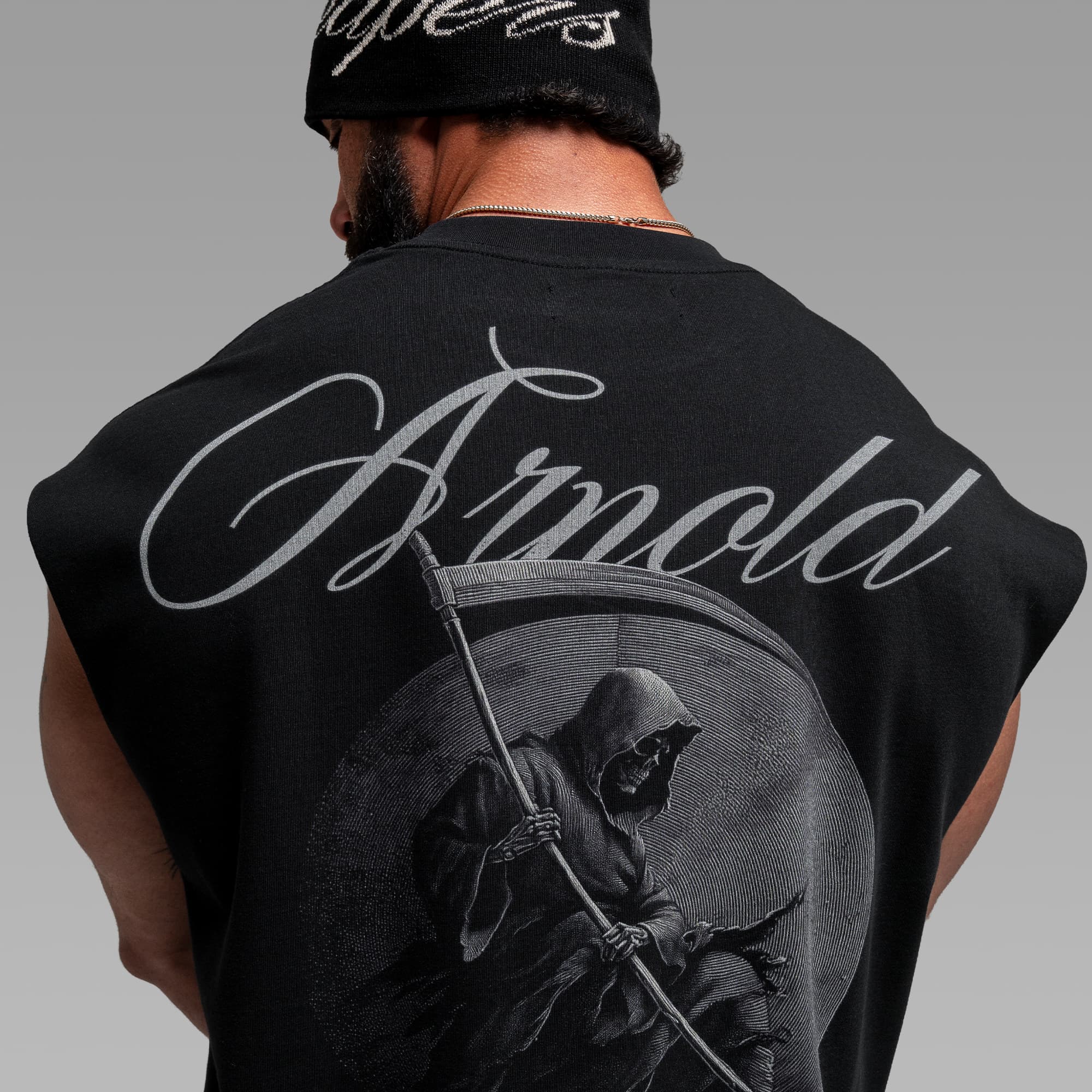 Athlete wearing the Midnight Reaper Cut Off close up shot of back graphic