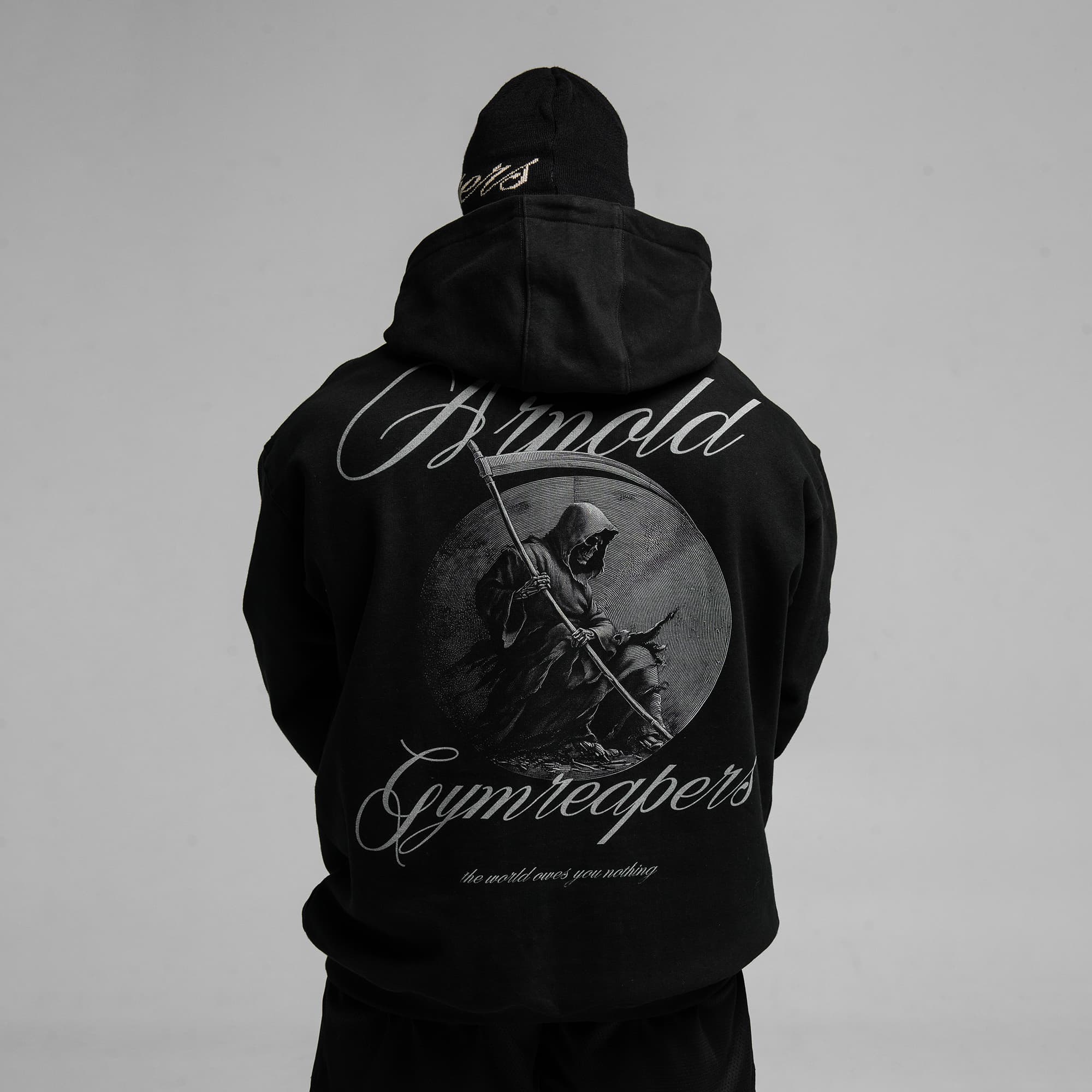 Athlete wearing Midnight Reaper Hoodie half body shot back view