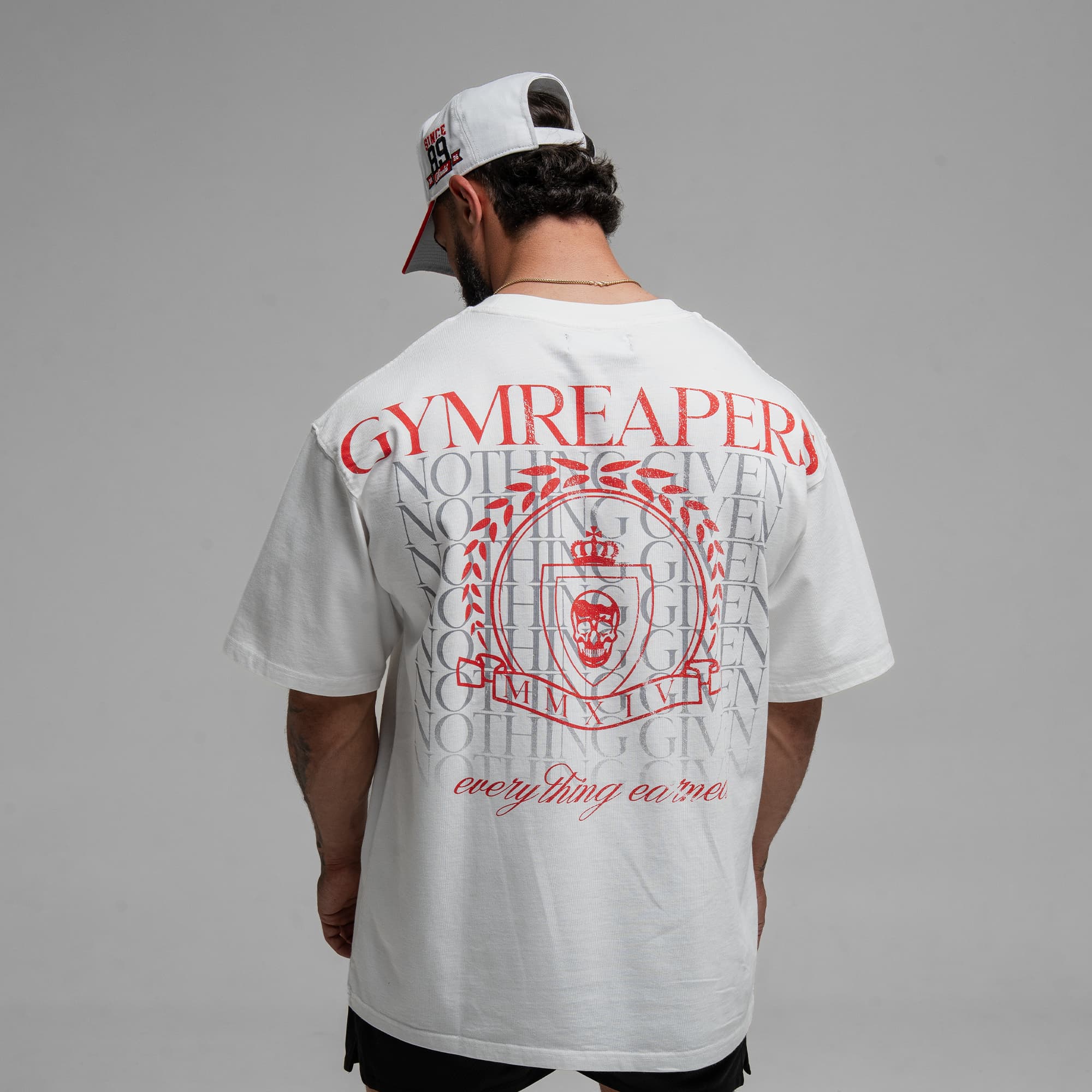 Athlete wearing the GR Emblem Tee half body shot back view