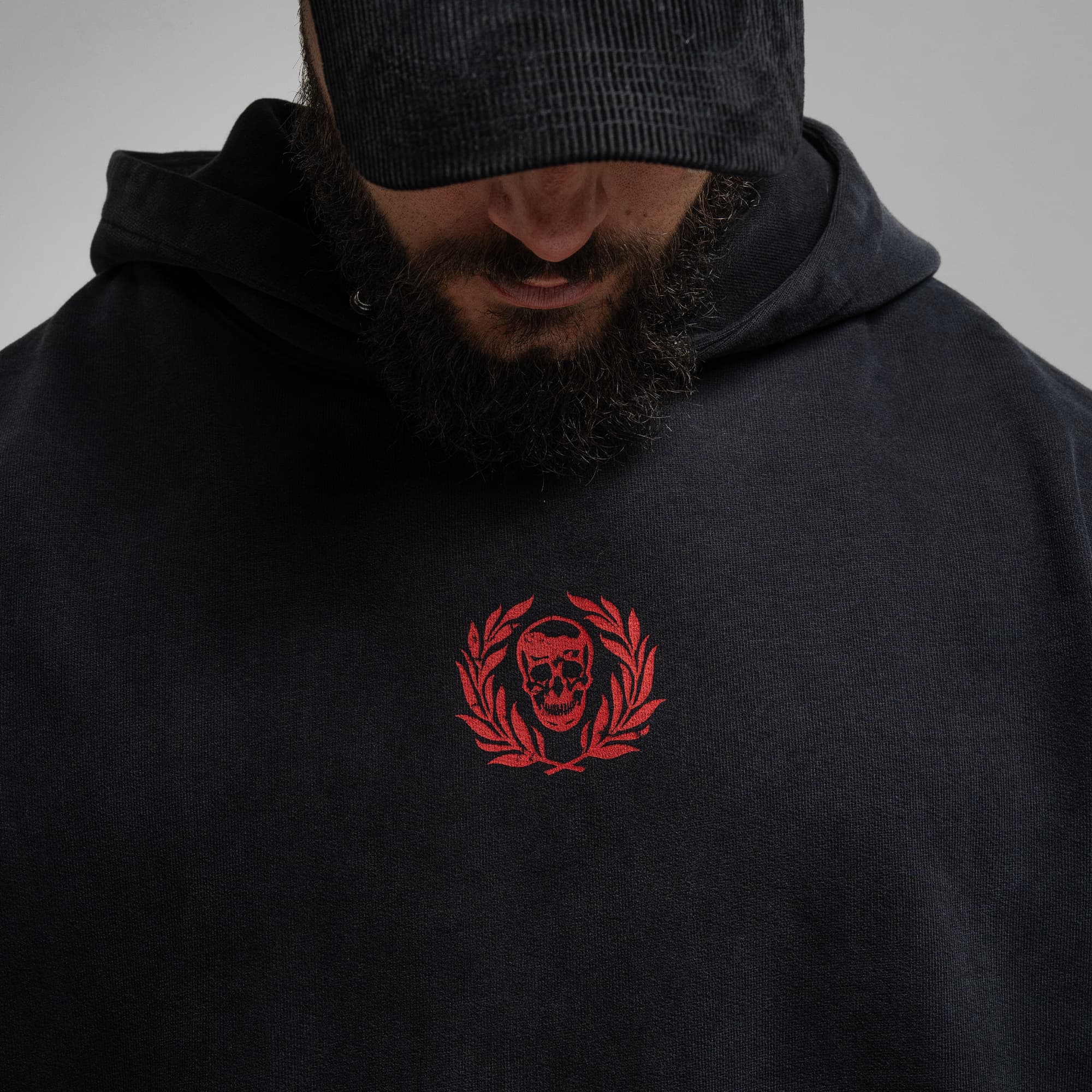 Athlete wearing the Loyalty Club Hoodie close up shot of front logo