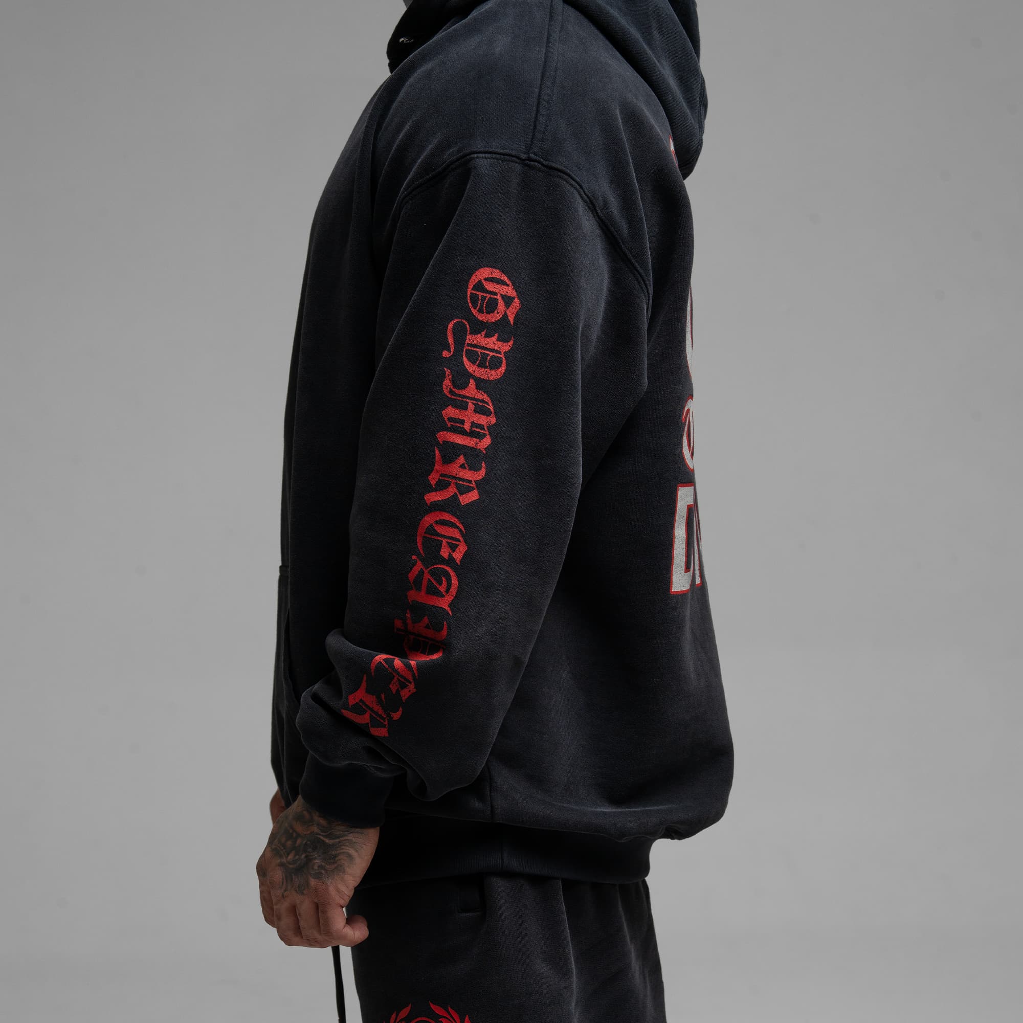 Athlete wearing the Loyalty Club Hoodie half body shot left side view