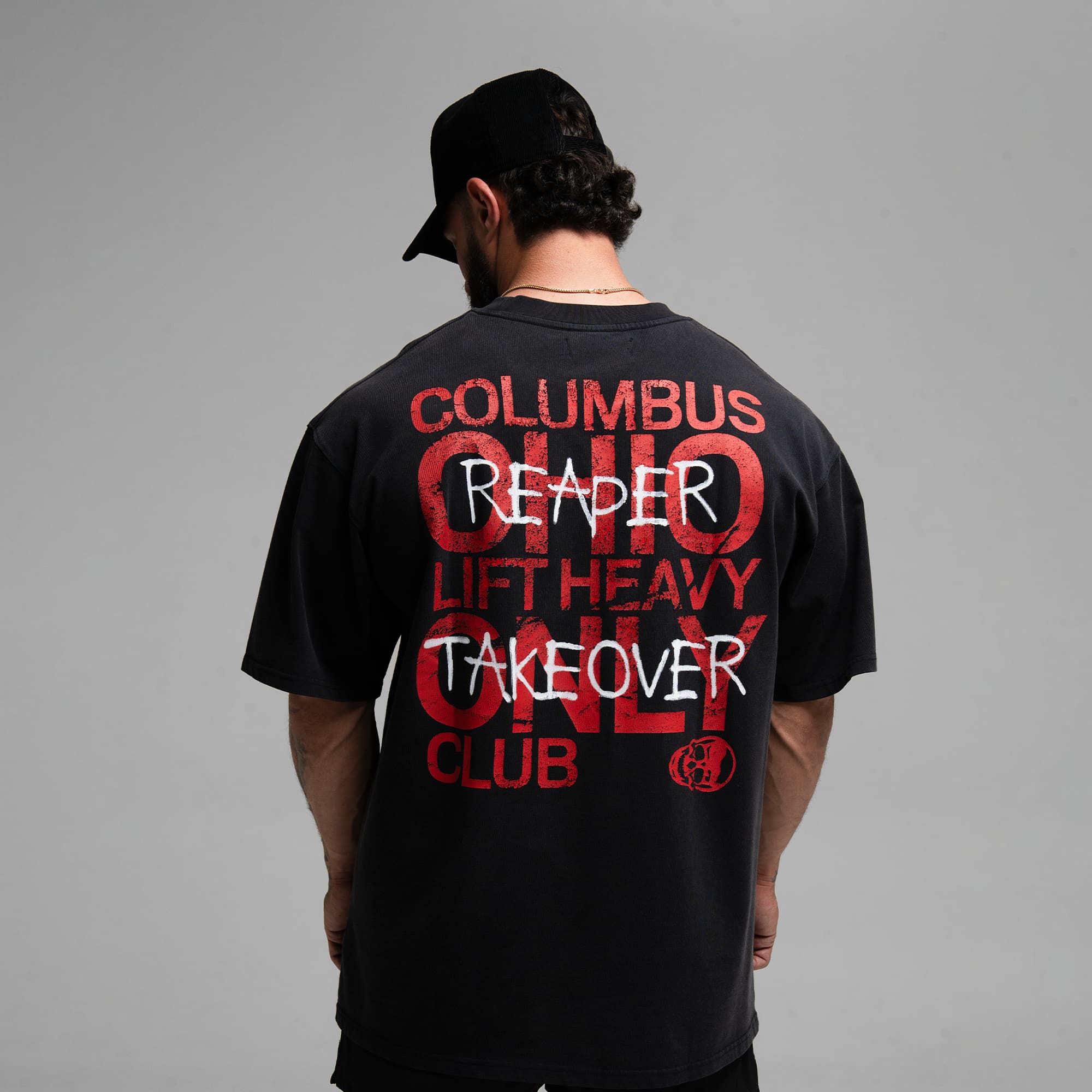 Athlete wearing the Takeover Club Tee half body shot back side