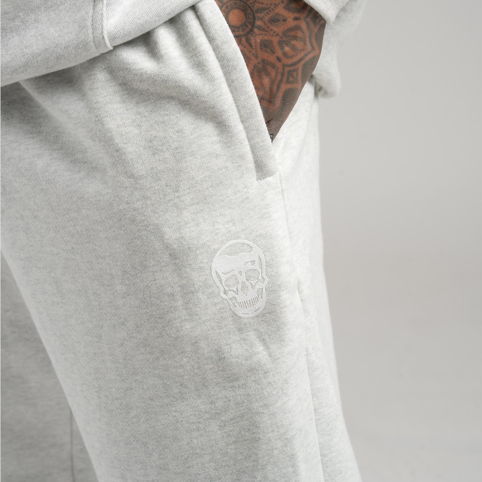 athlete wearing the light heather gray heavyweight jogger