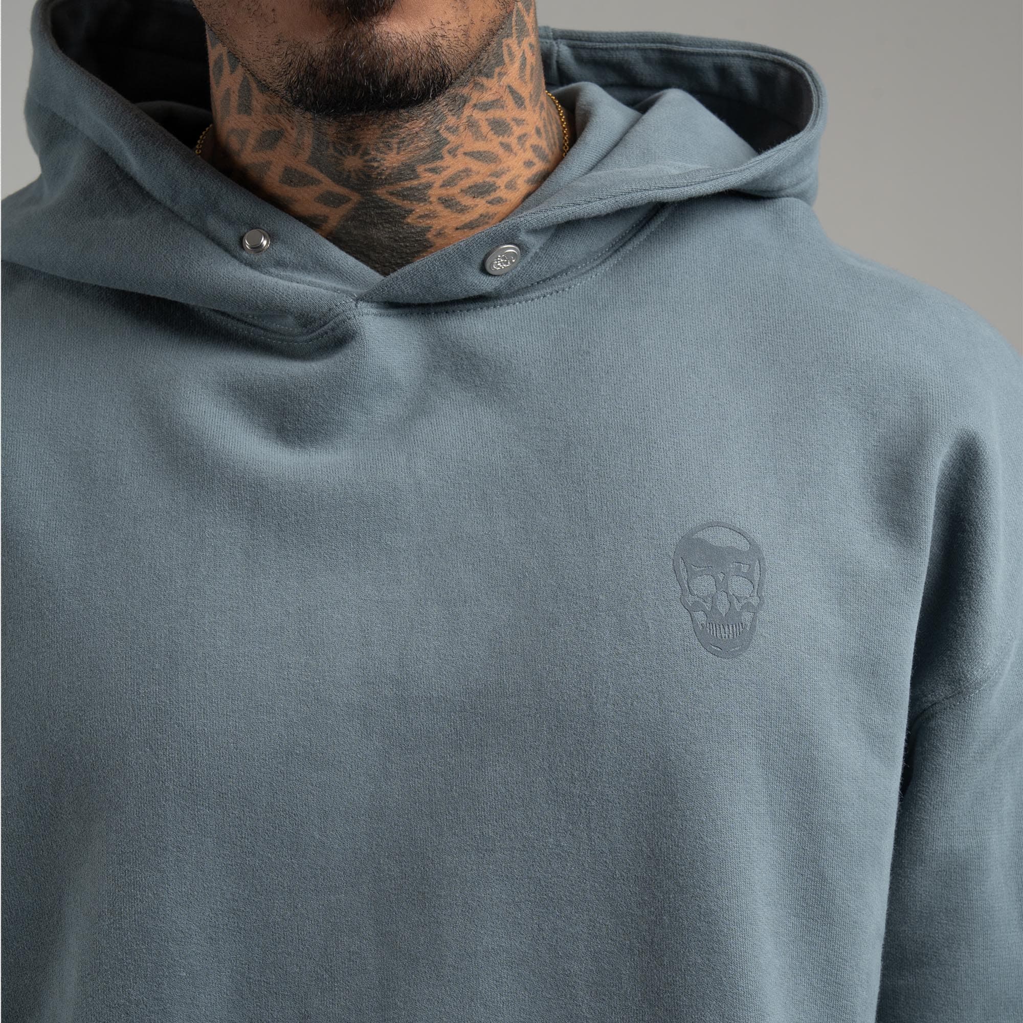 Athlete wearing Lake Heavyweight Hoodie close up of logo