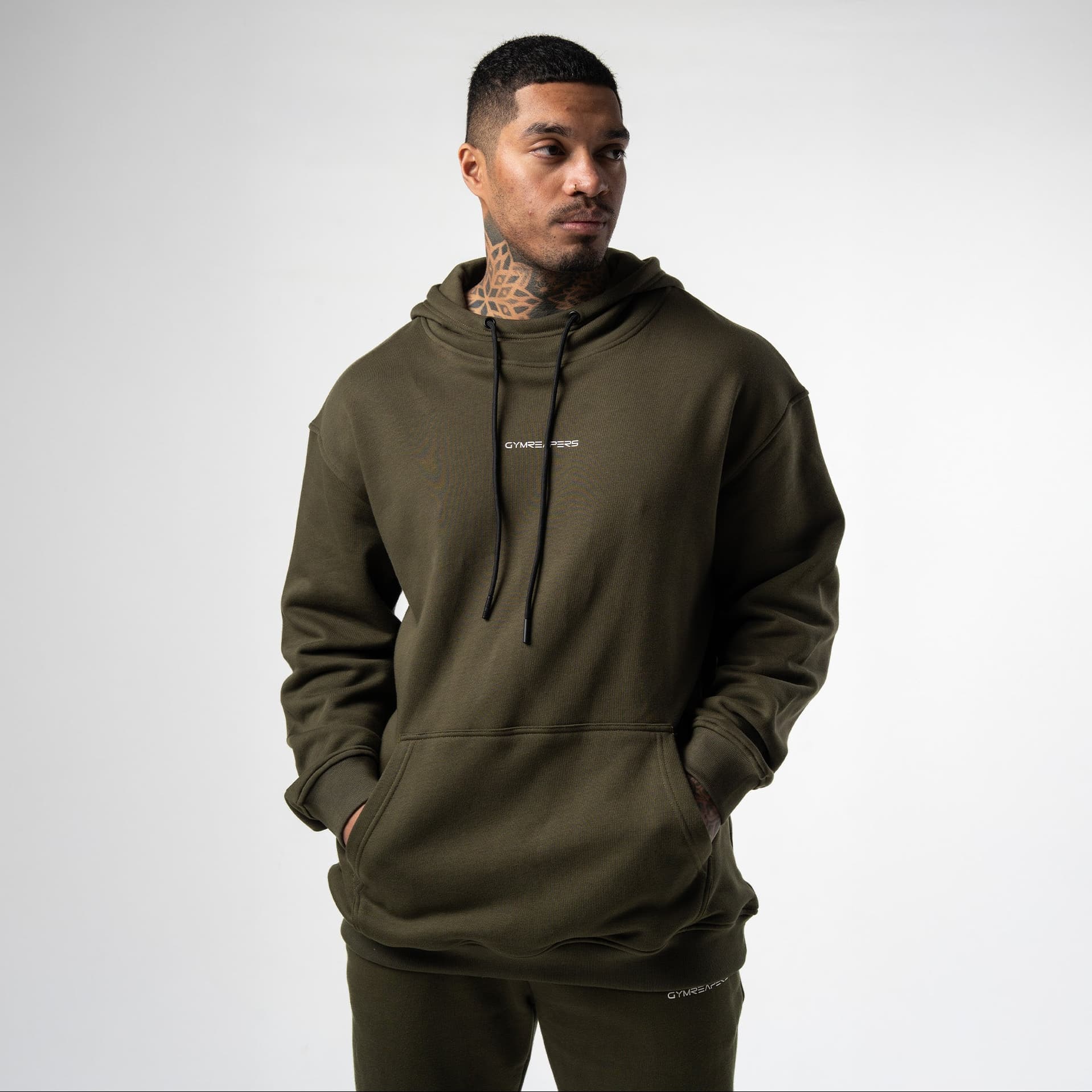 athlete wearing green axis mockneck hoodie front view