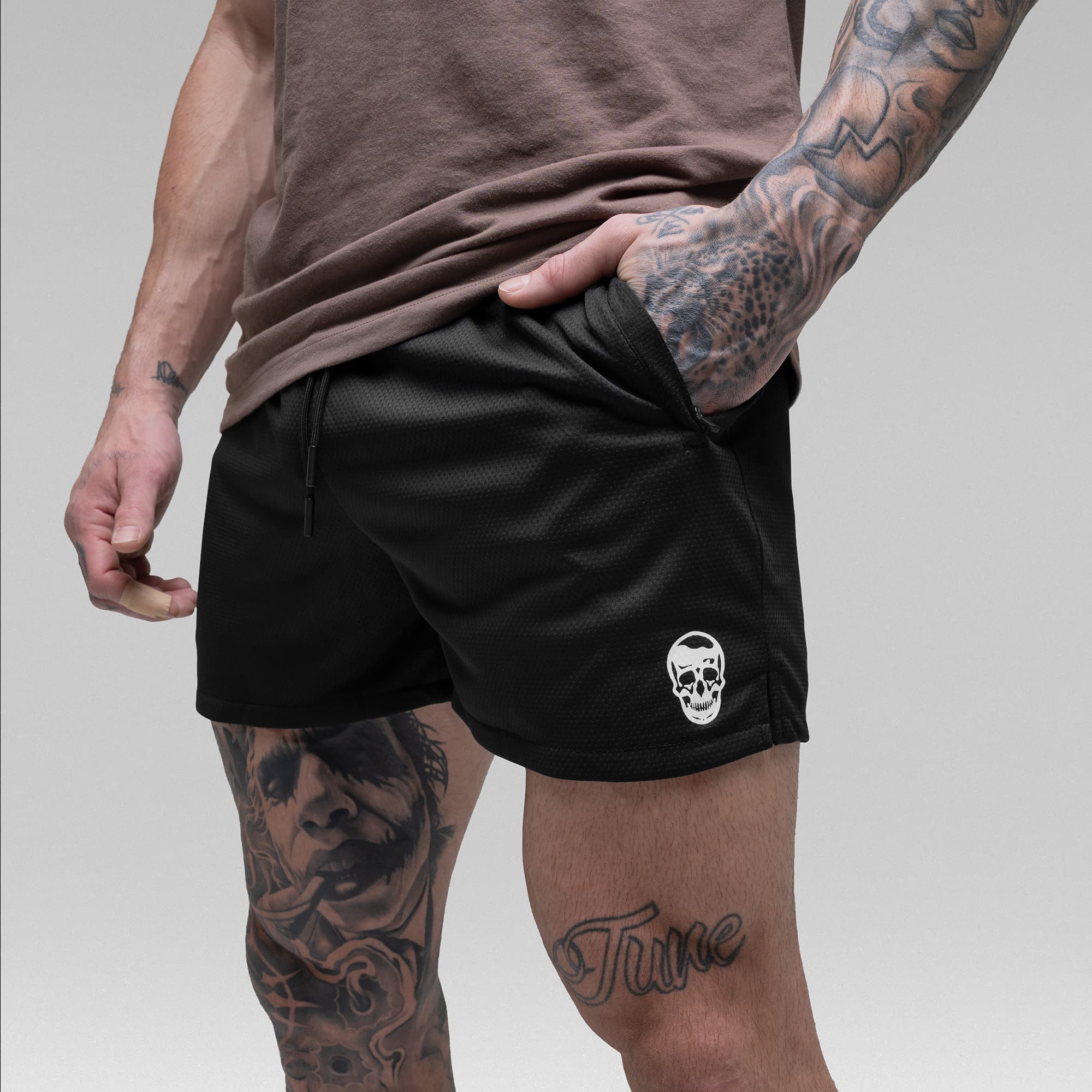 Athlete wearing the Black/White Core Skull Mesh Training Shorts detail shot of pocket