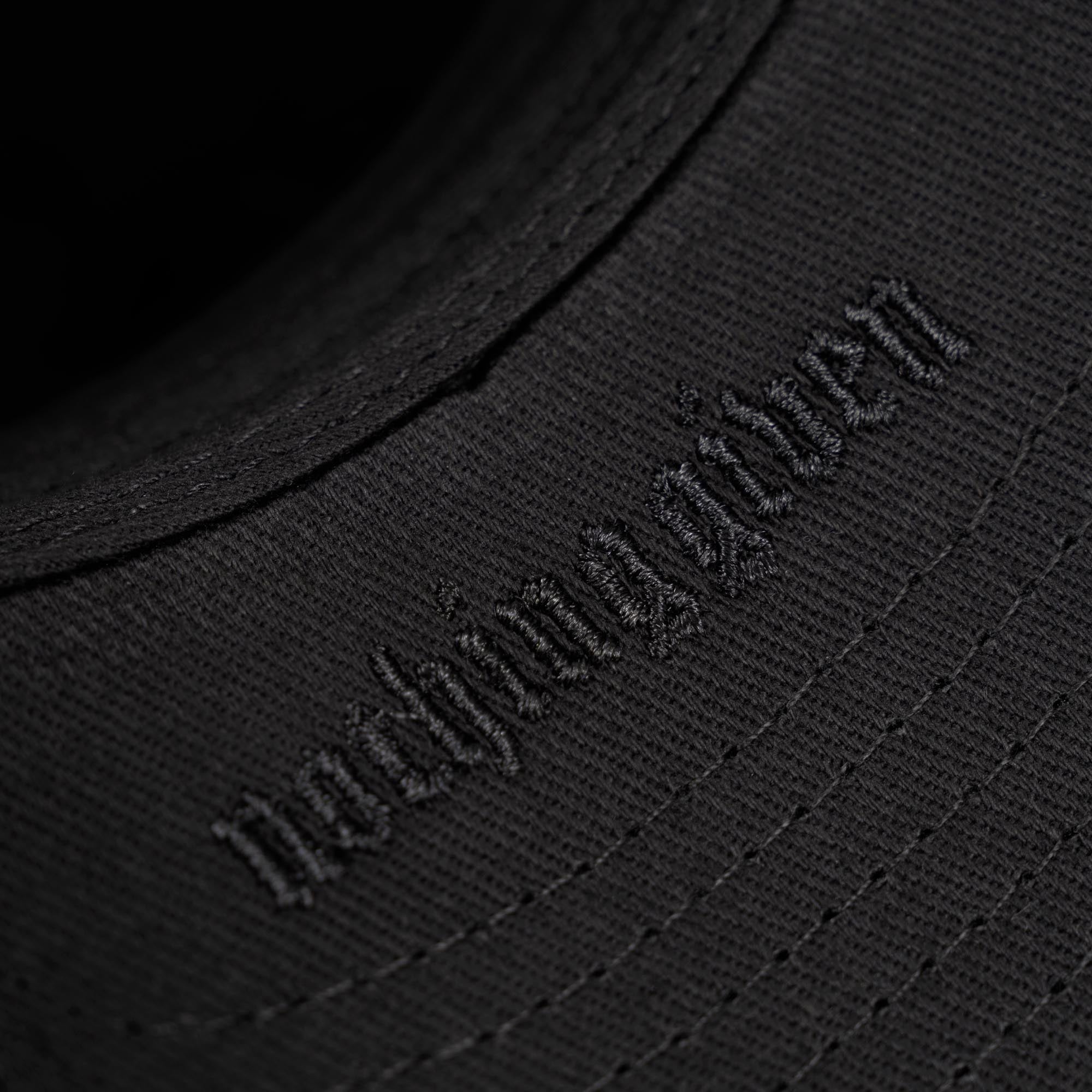 Gray 5-Panel Initial Suede Hat detail shot of embroidered logo