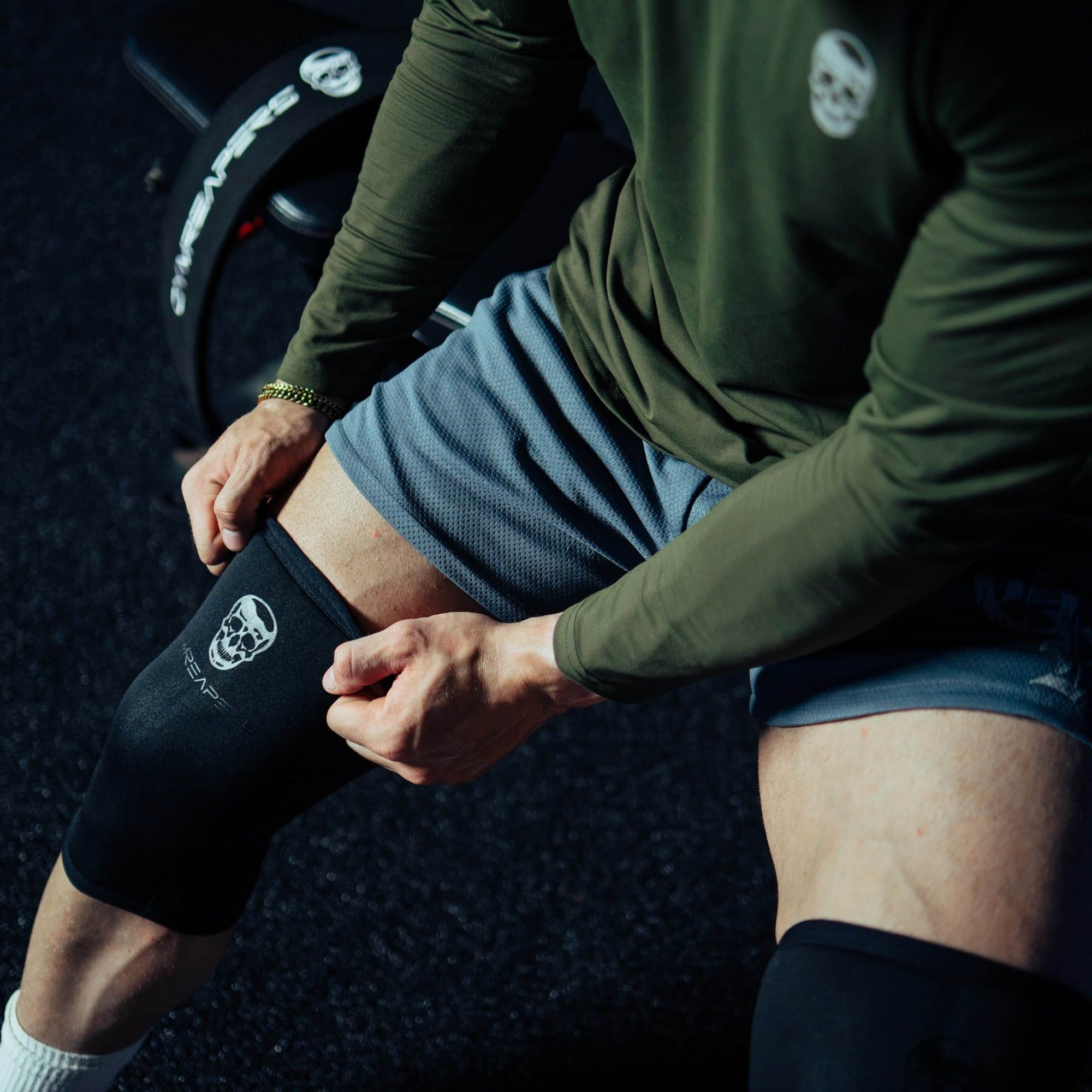 black black knee sleeves sitting down stretch