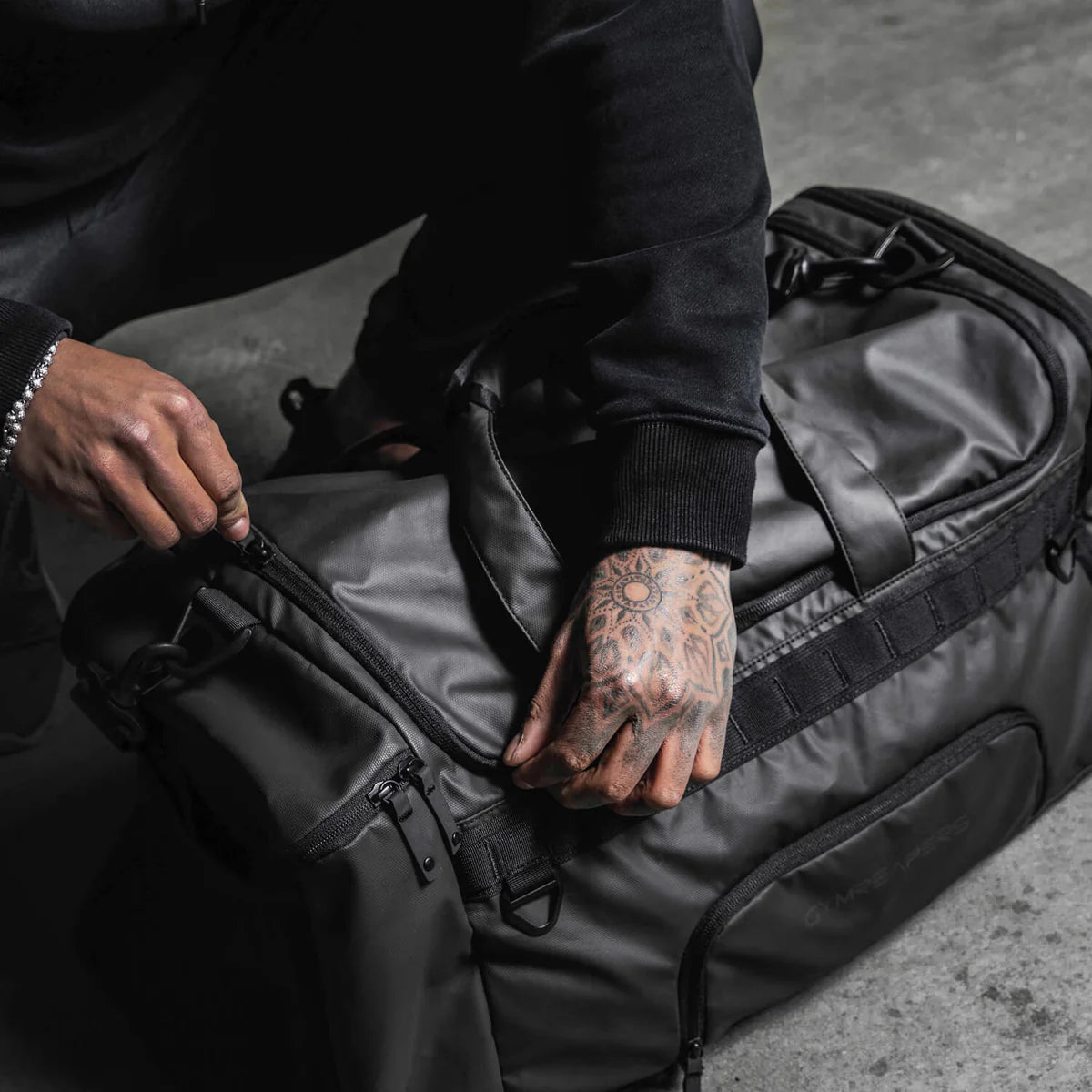 duffle bag being zipped up