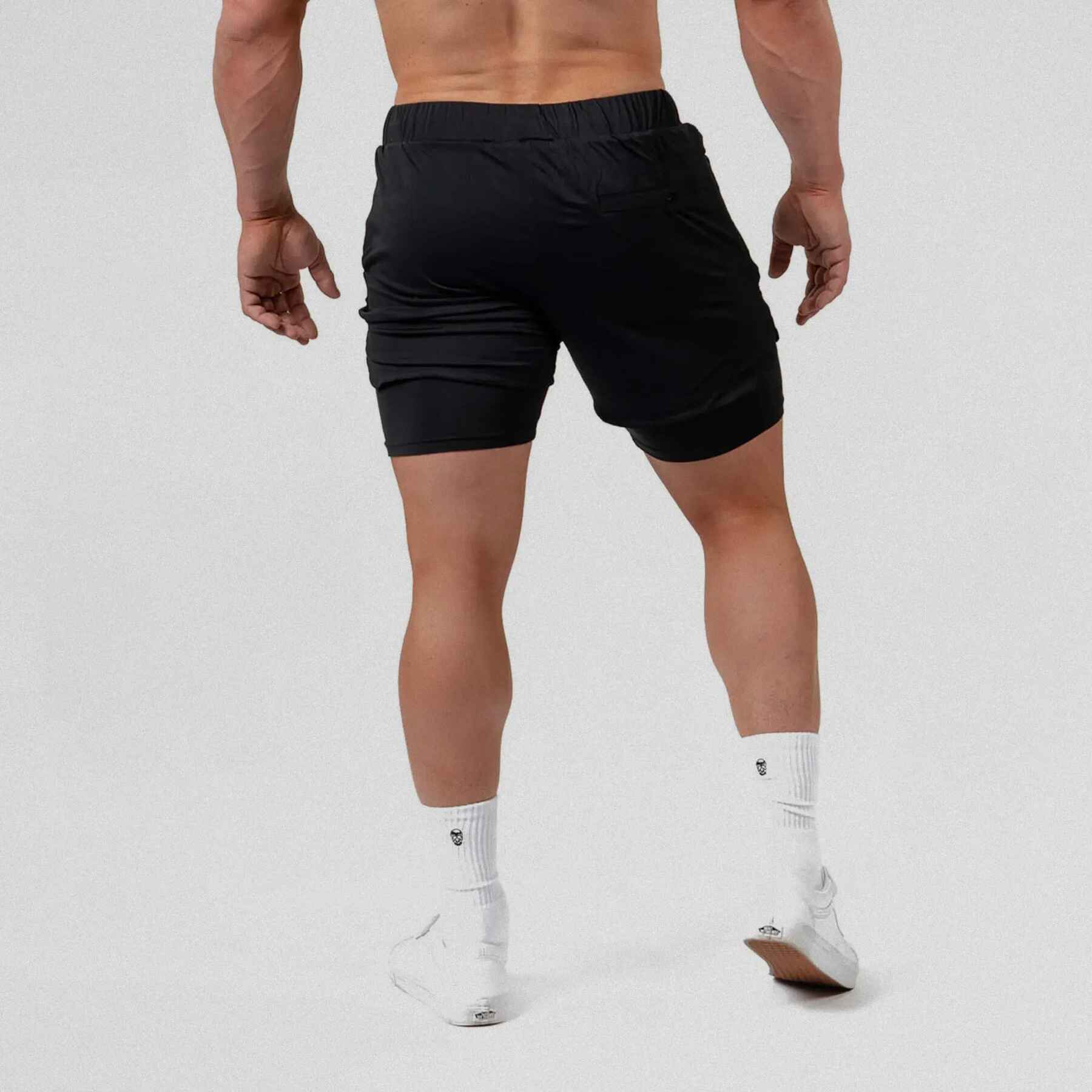 Gymreapers React training shorts black color way on athlete showcasing the back of the shorts.