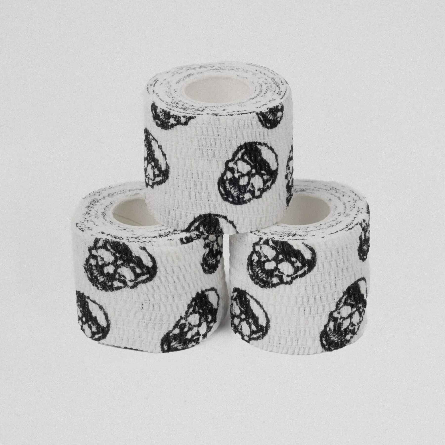 Three pieces of skull tape stacked on top of each other.